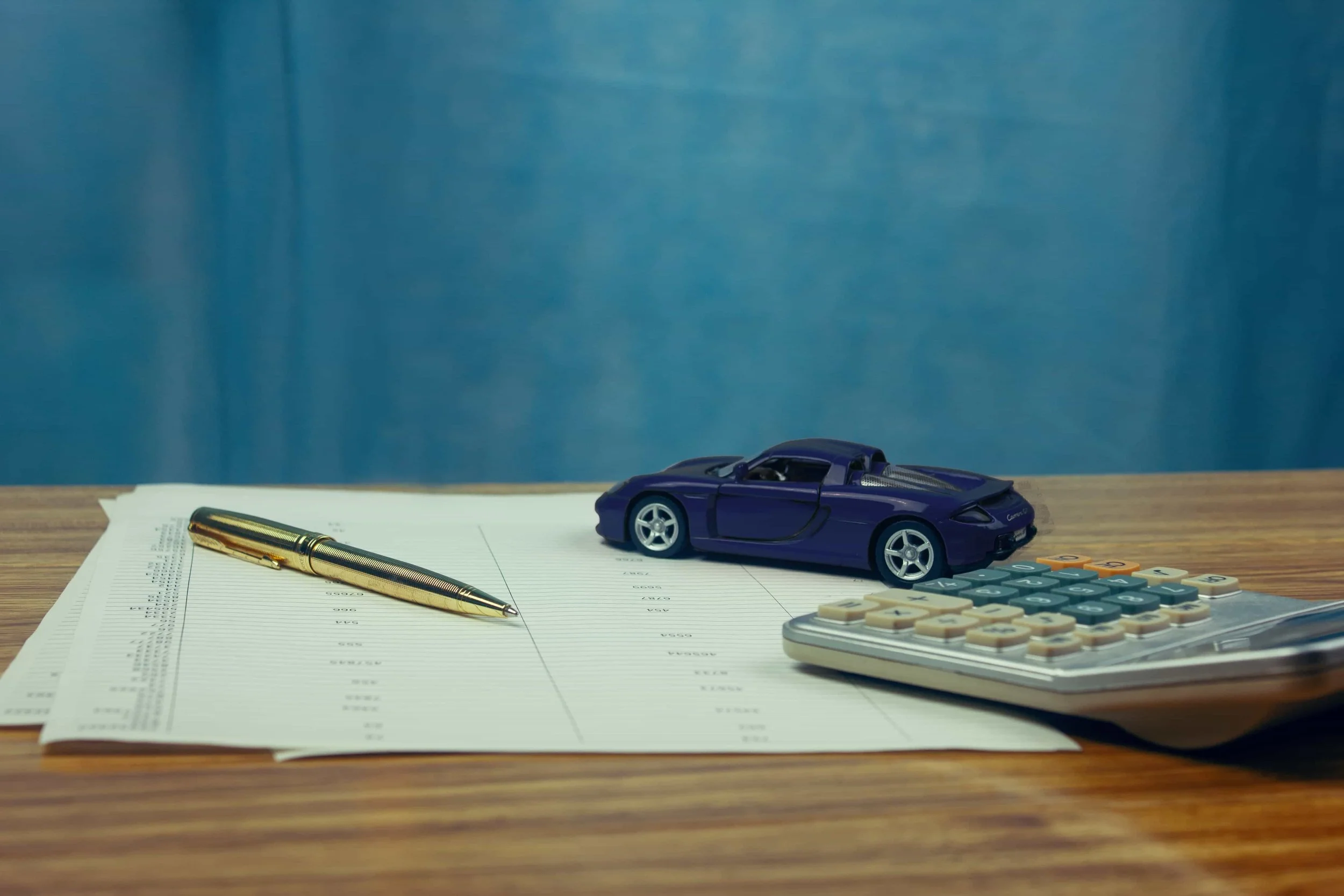 Veneziano & Lighthall brand image of car with papers
