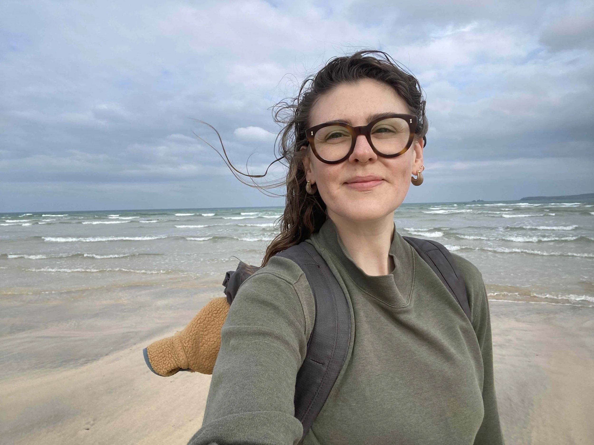Woman with ocean behind