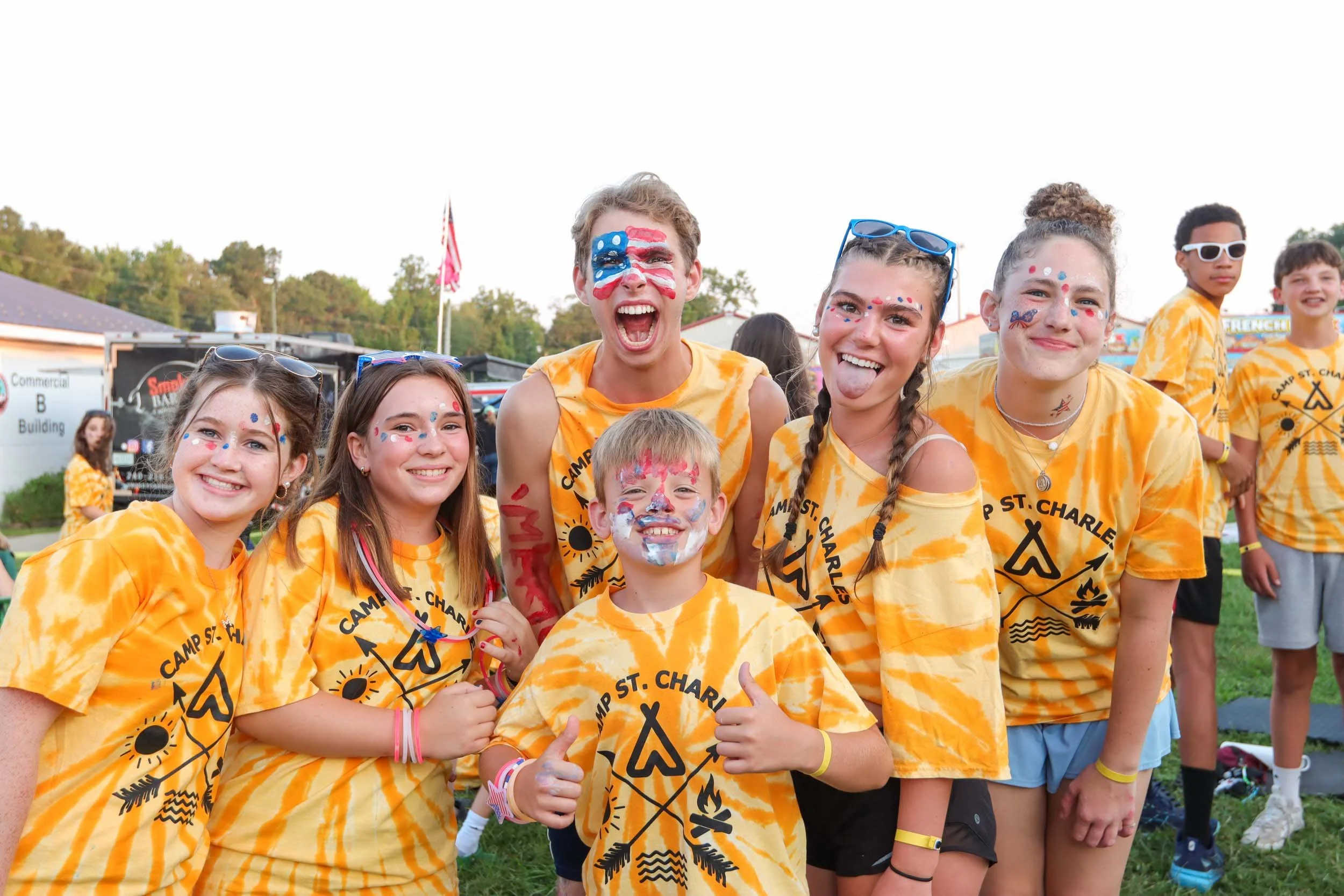 Campers and counselors wearing matching tie-dye shirts for the 4th of July.
