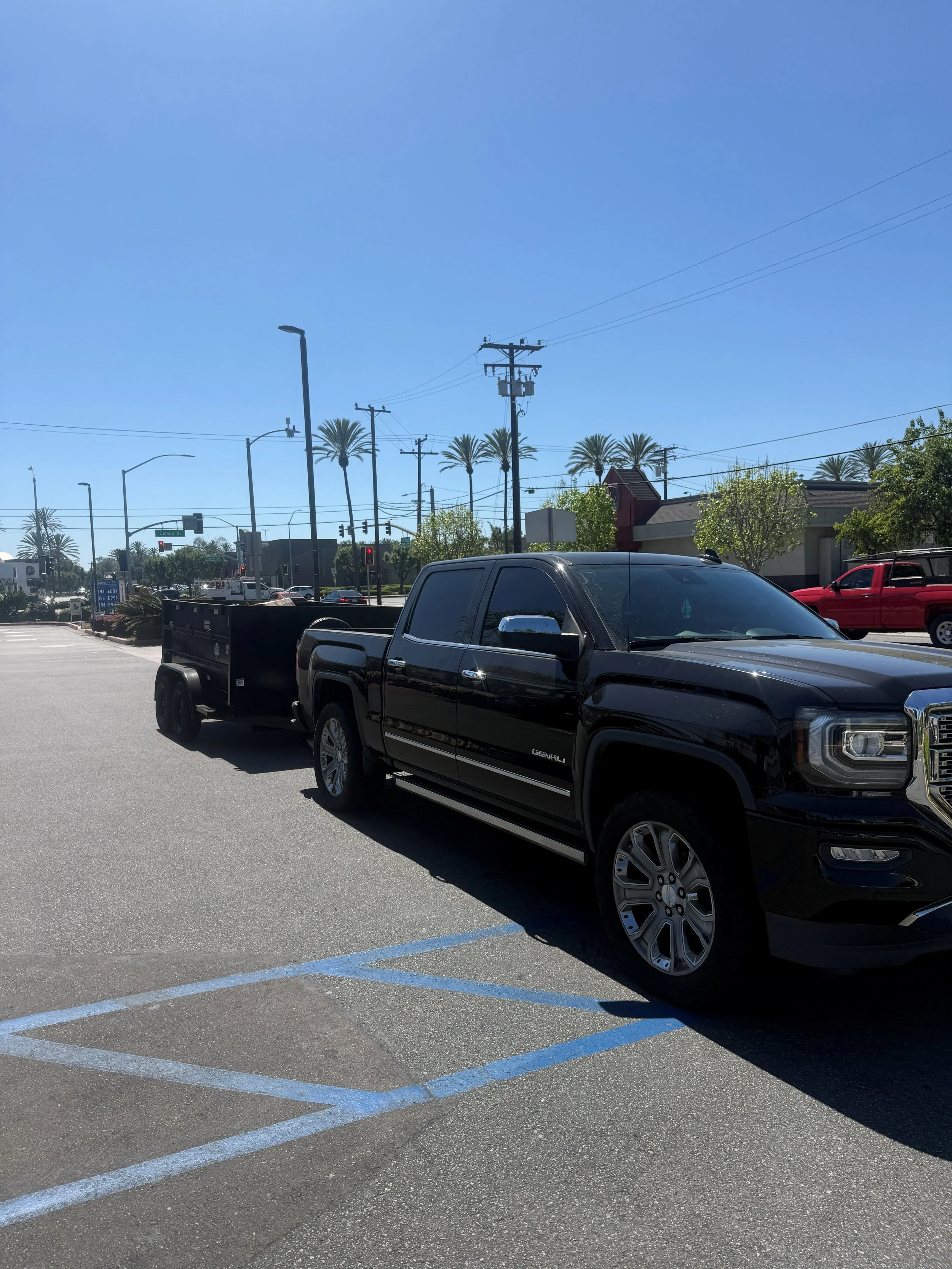 Black pickup truck parked in a parking lot.