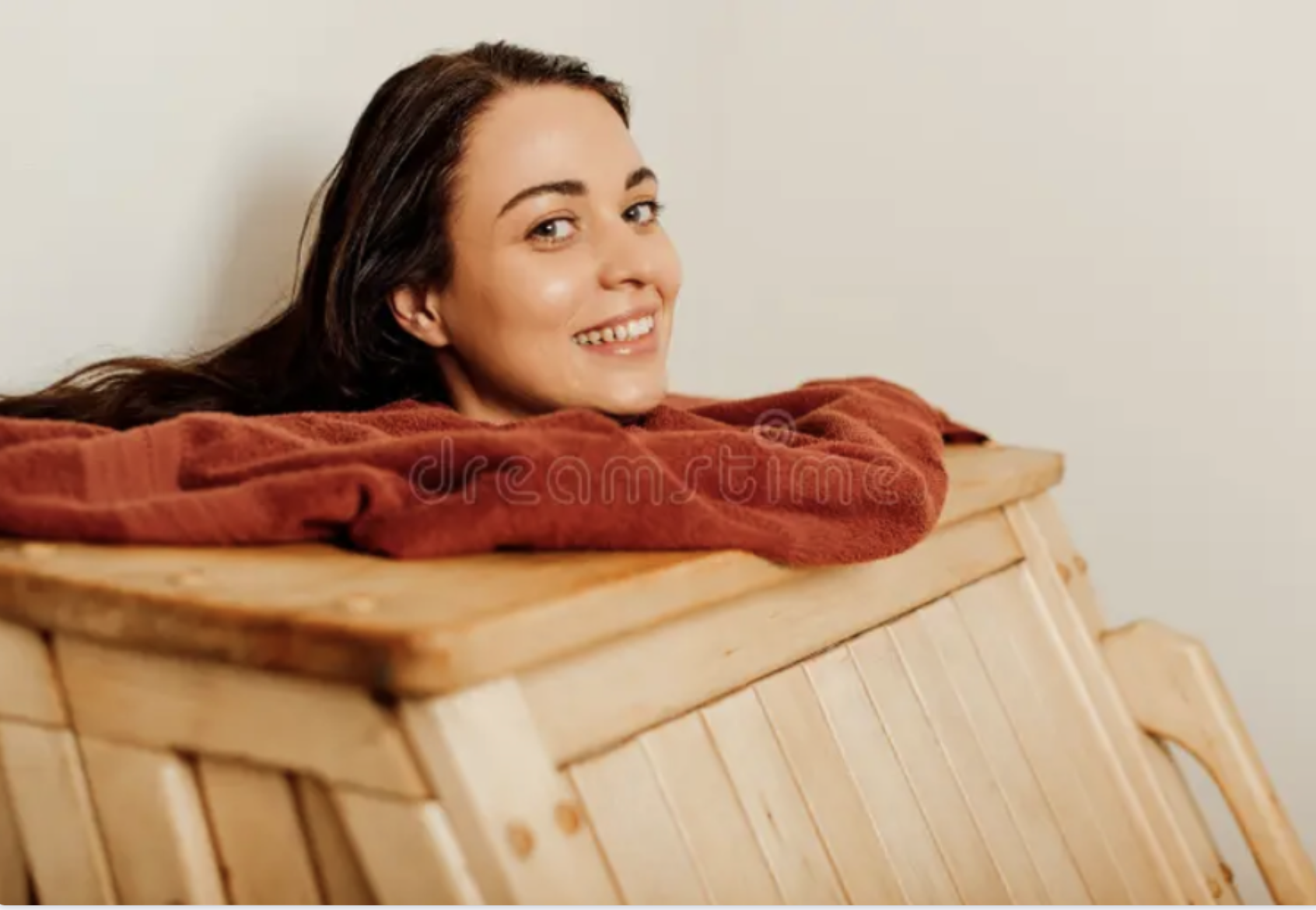 A person receiving a steam cabinet detox treatment, an Ayurvedic Swedana therapy to open the pores and relax the muscles.