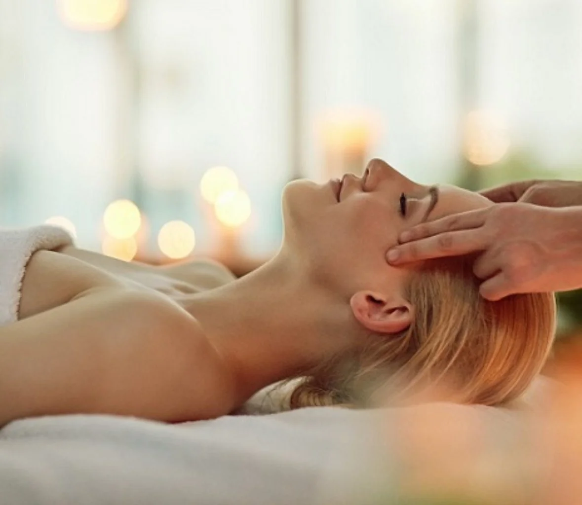 Person receiving a Marma Therapy treatment on their shoulders from a therapist.