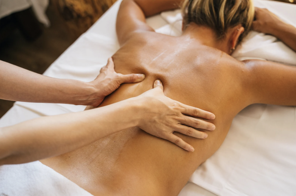 A person receiving an Ayurvedic Marma treatment.
