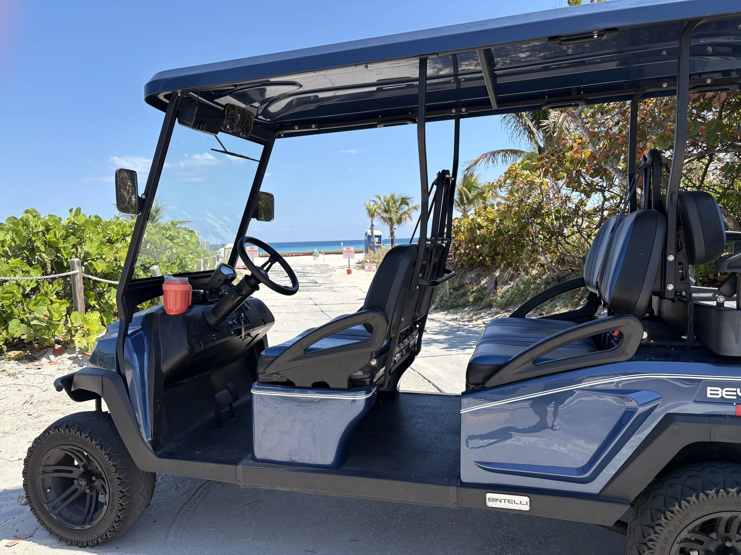 Delray Cart Life golf cart parked near the beach in Delray Beach, Florida