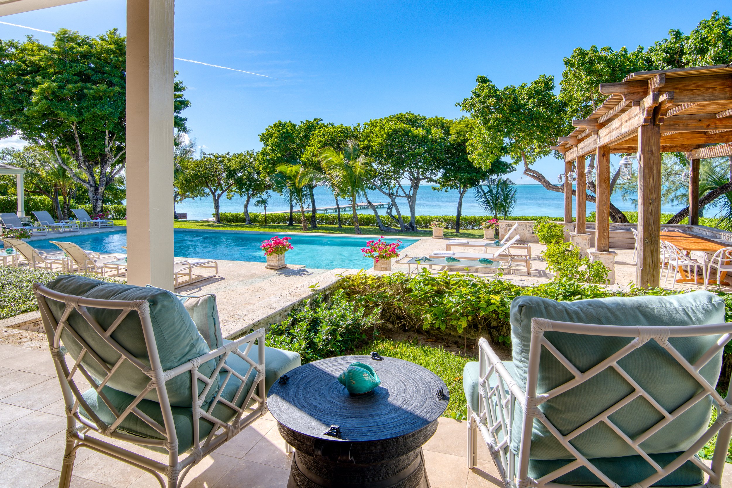 View of pool and harbour from covered veranda