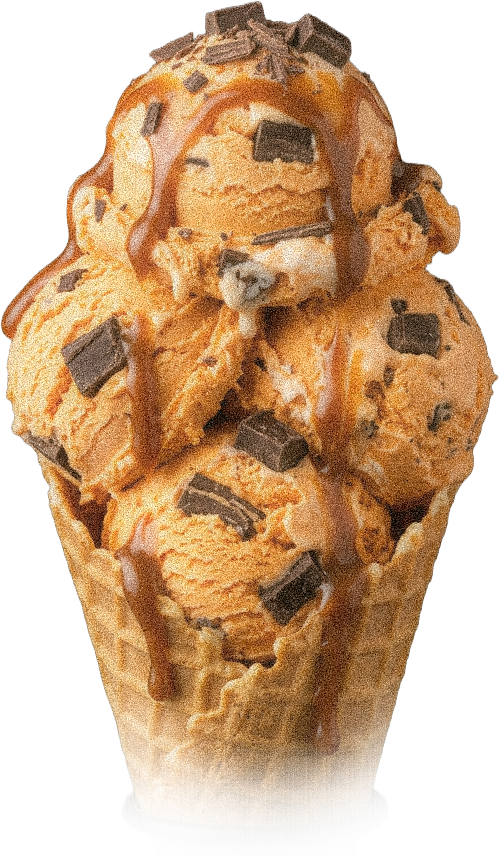 Ice cream cone with three scoops, chocolate chunks, caramel drizzle, and a waffle cone.