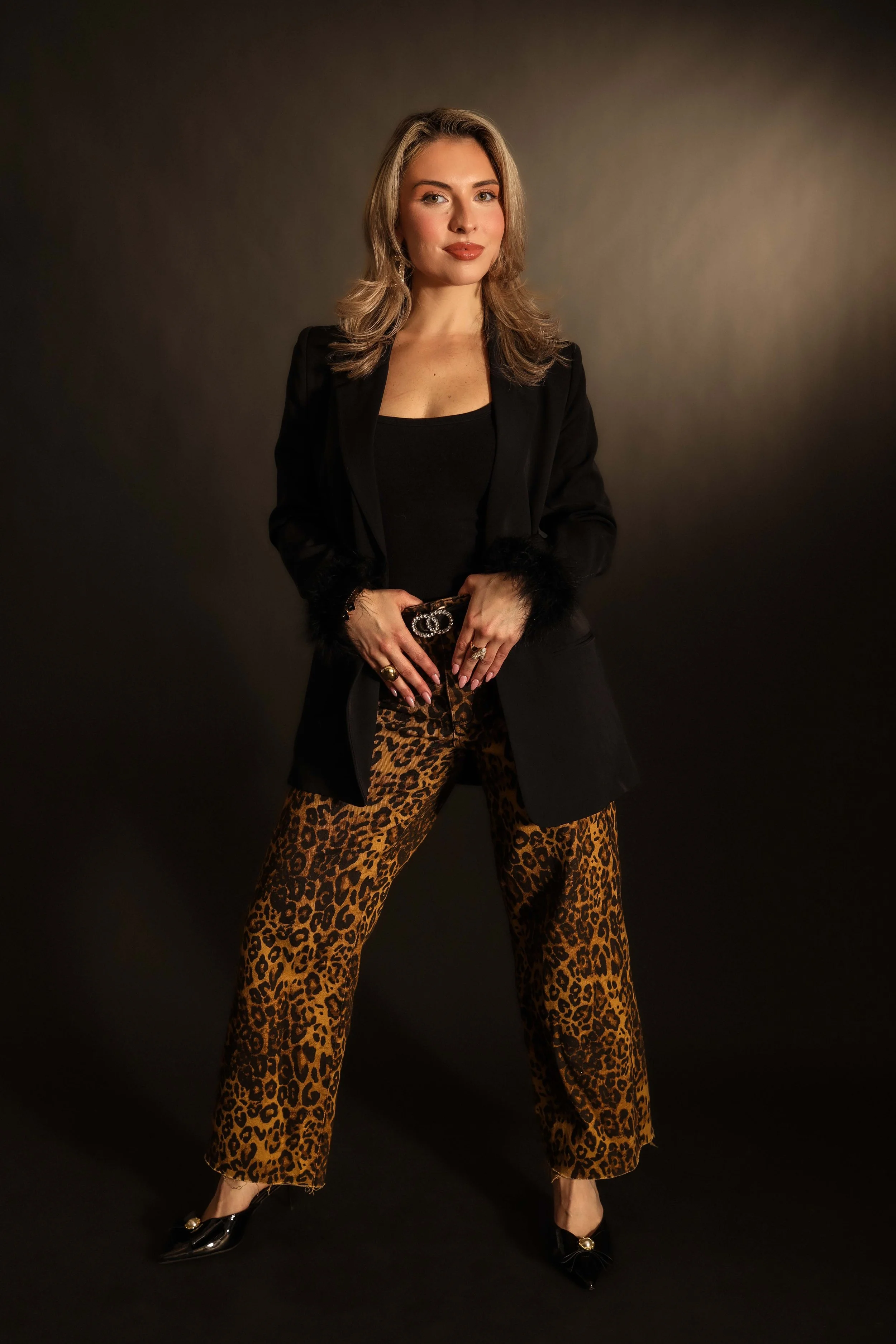 Valerie High Fashion - both hands on belt soft smile lunge.jpg