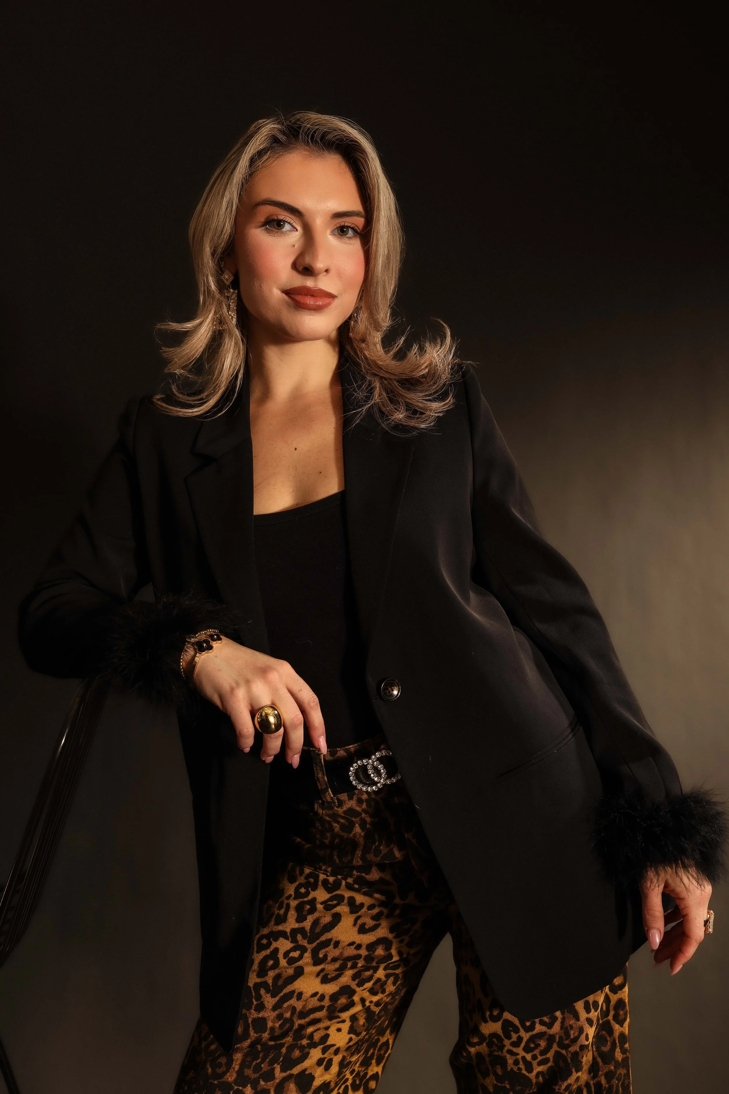 Valerie High Fashion - leaning on chair smirk straight .jpg