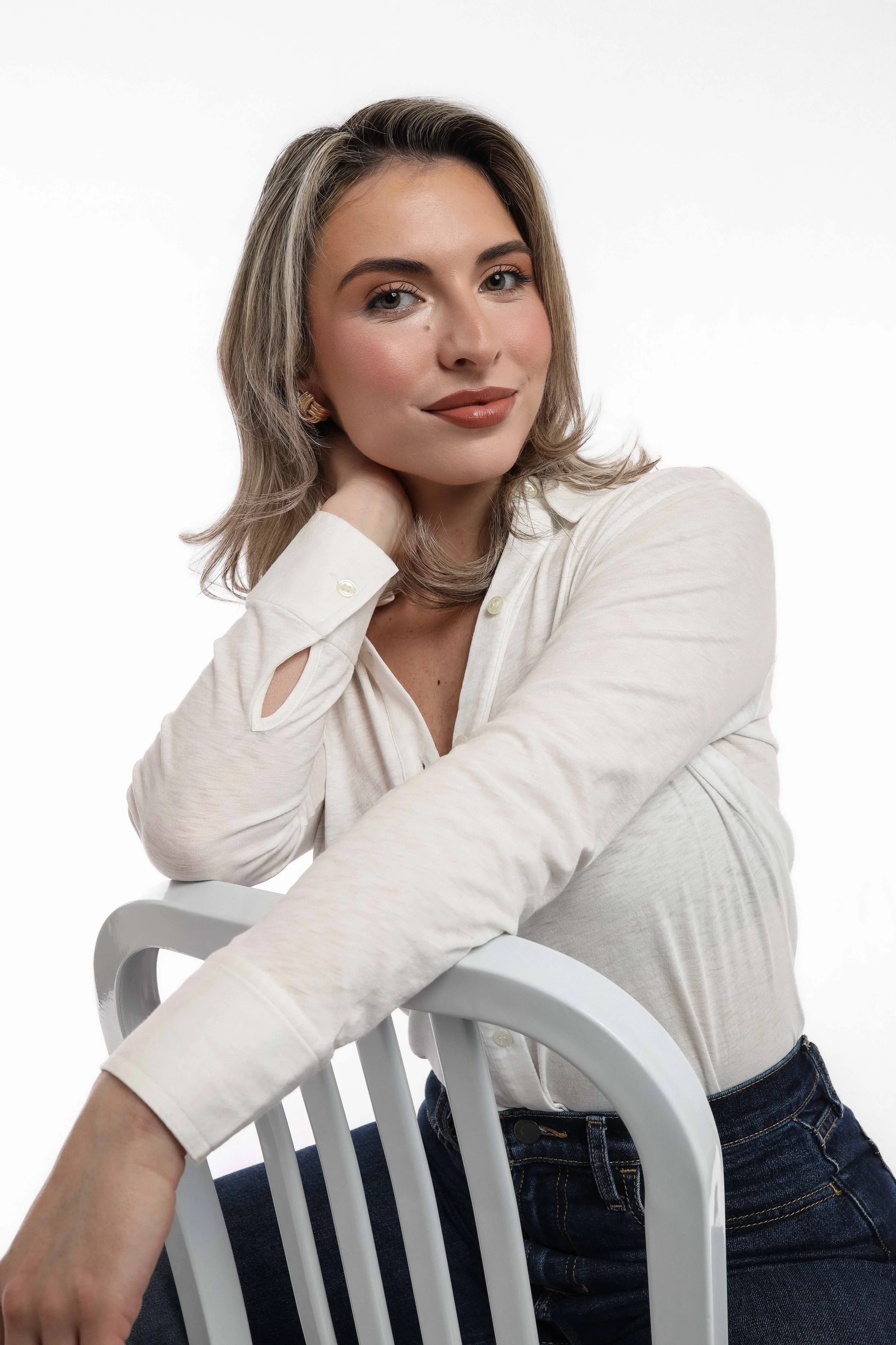 Valerie Headshot - hand on neck soft smile.jpg