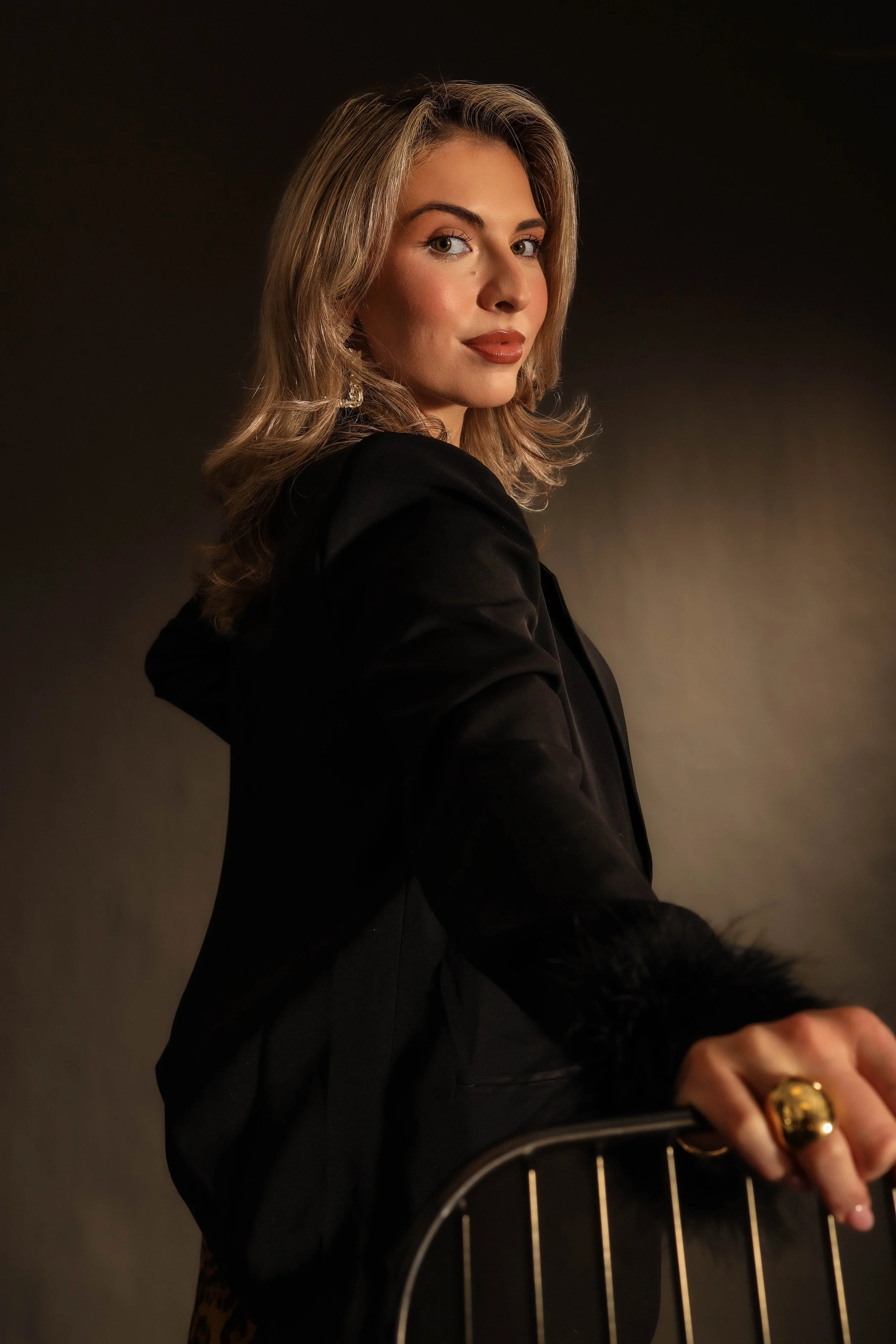 Valerie High Fashion - looking back on chair one arm.jpg