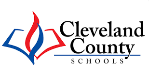 Cleveland County Schools logo featuring an open book with a red flame and blue pages.