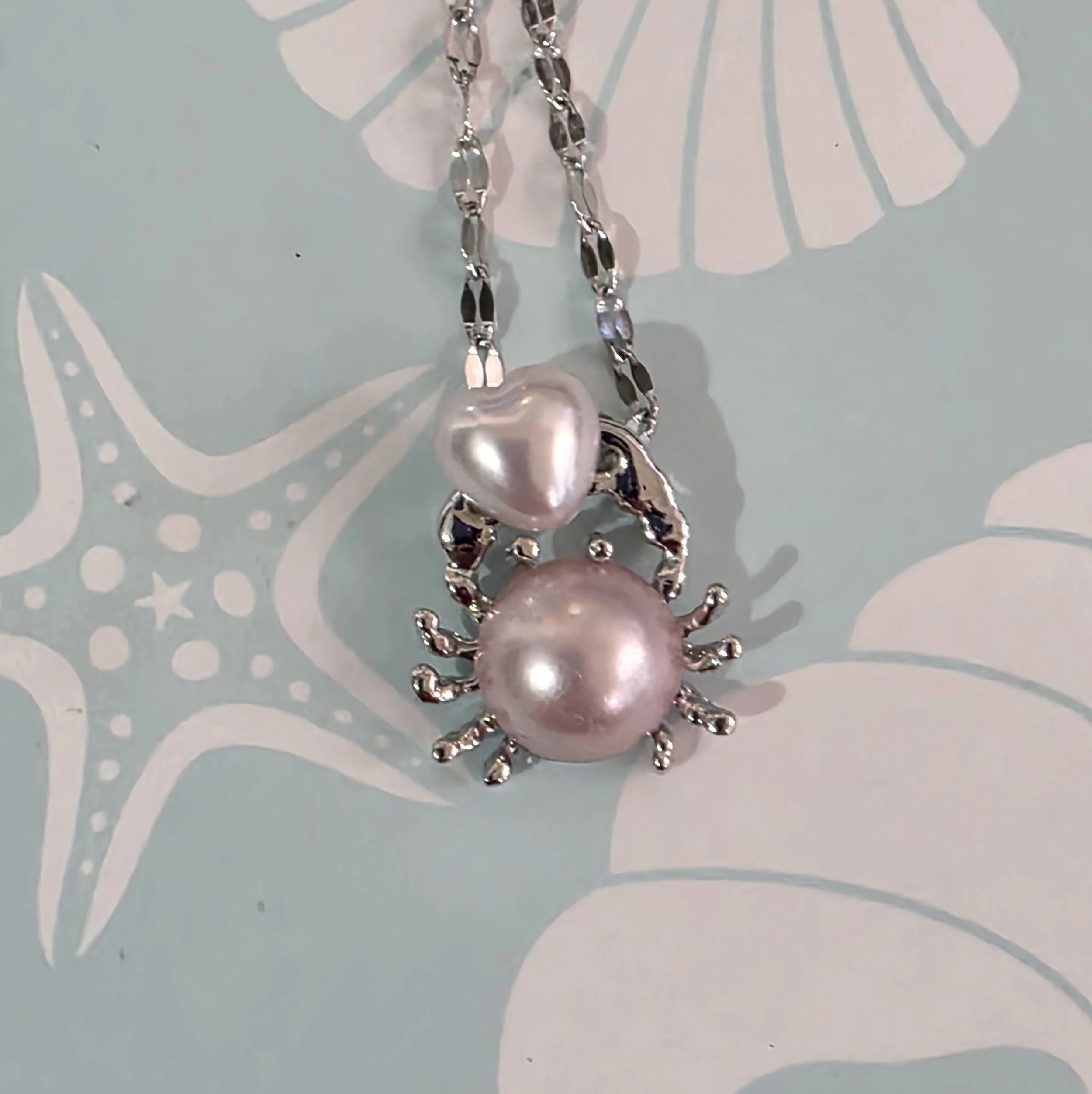 Pink Button Crab with Heart Neckless.jpg