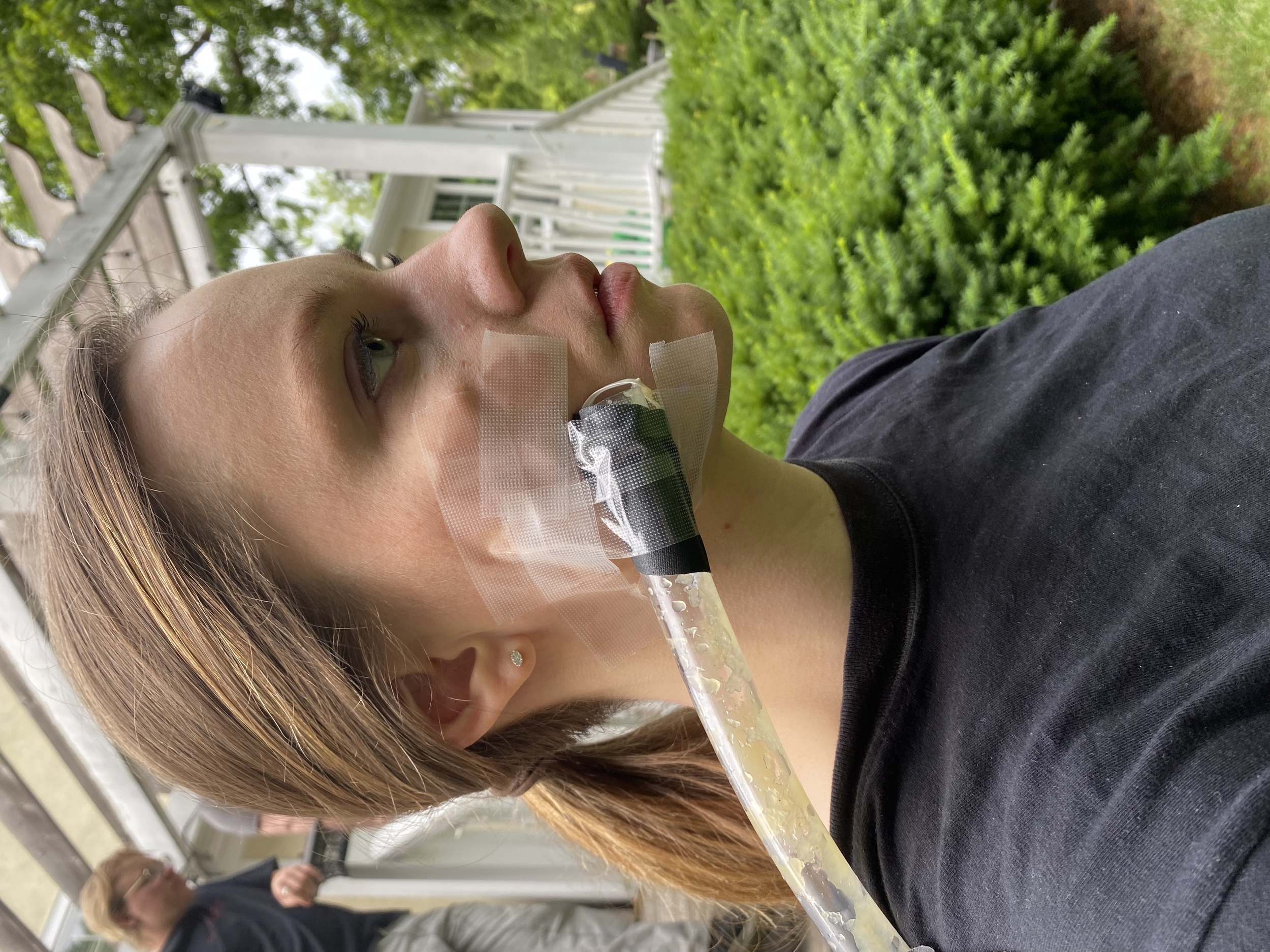 The hose attached to the actor's face