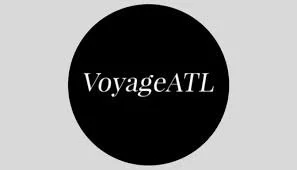 Black circle with white text saying 'VoyageATL' on a gray background.