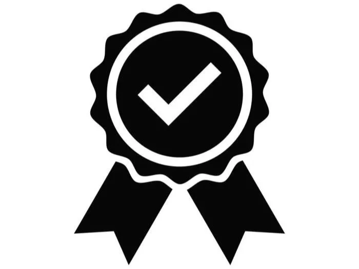 Black and white icon of a ribbon with a checkmark in the center.