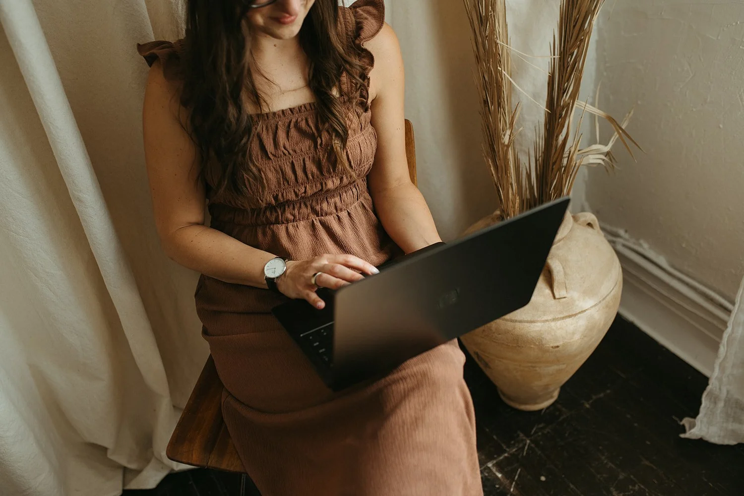 Close up of a laptop resting on Michelle's lap
