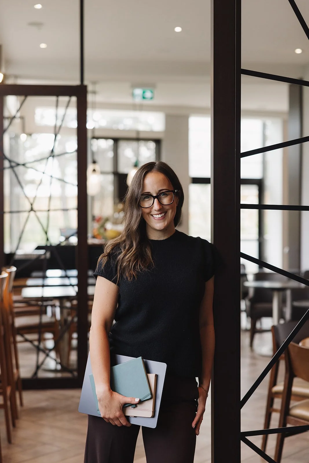 Michelle Arnason, CPA, founder of Build the Firm Co., in her office in Airdrie, Alberta Joelle Kindret, Operations Manager at Arnason Accounting & Co., standing