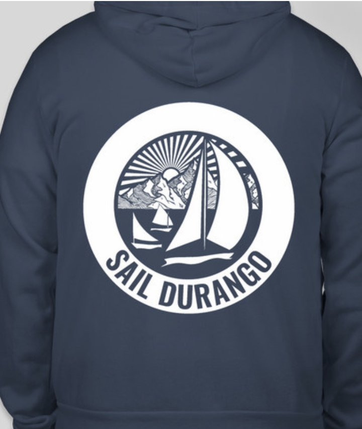 Back of navy hoodie with a circular logo featuring a sailboat, mountains, and sun, with the text "SAIL DURANGO".