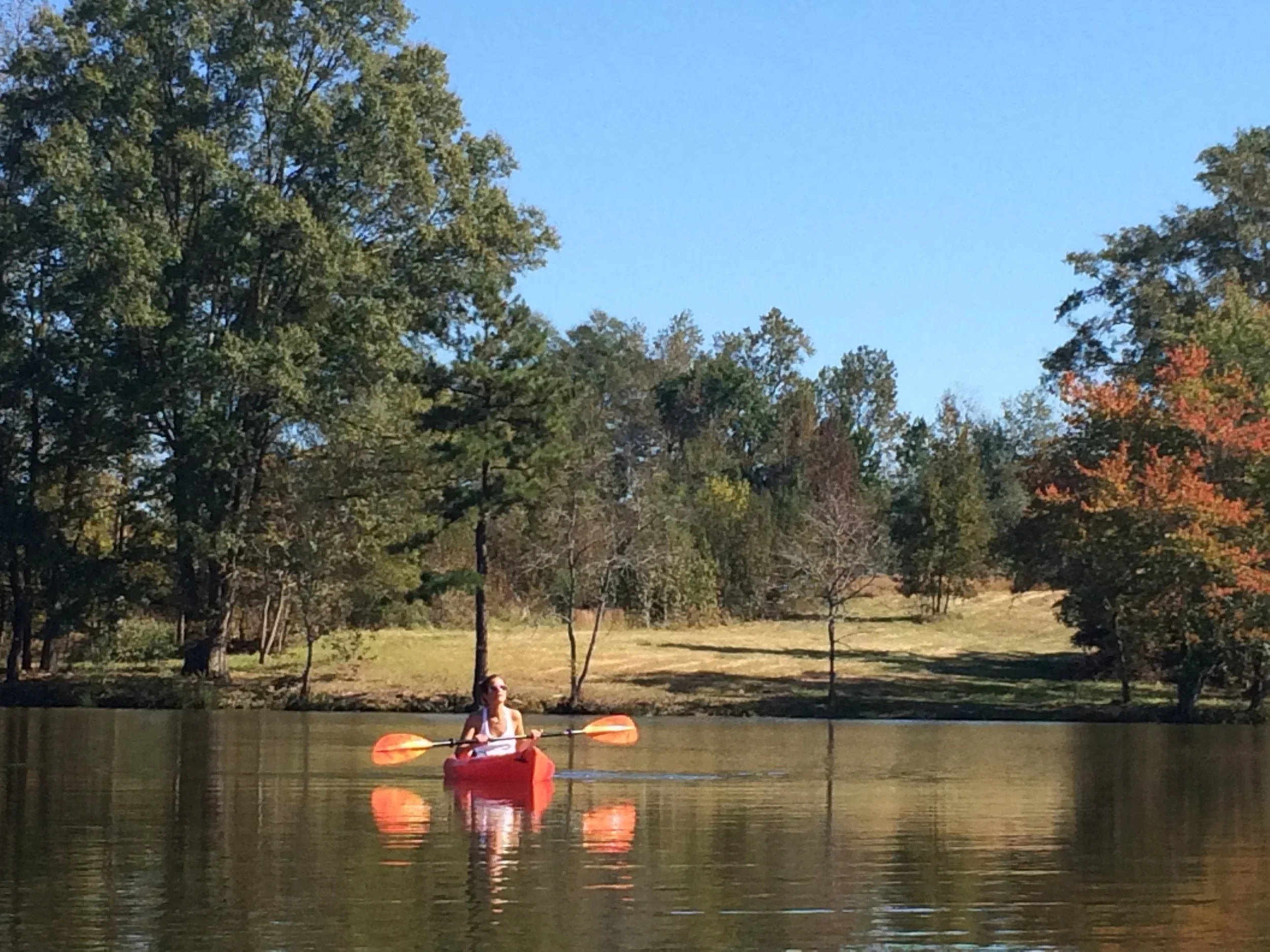 RuffwoodCountryClub_Colors_GirlRedCanoeOrangePaddles.webp