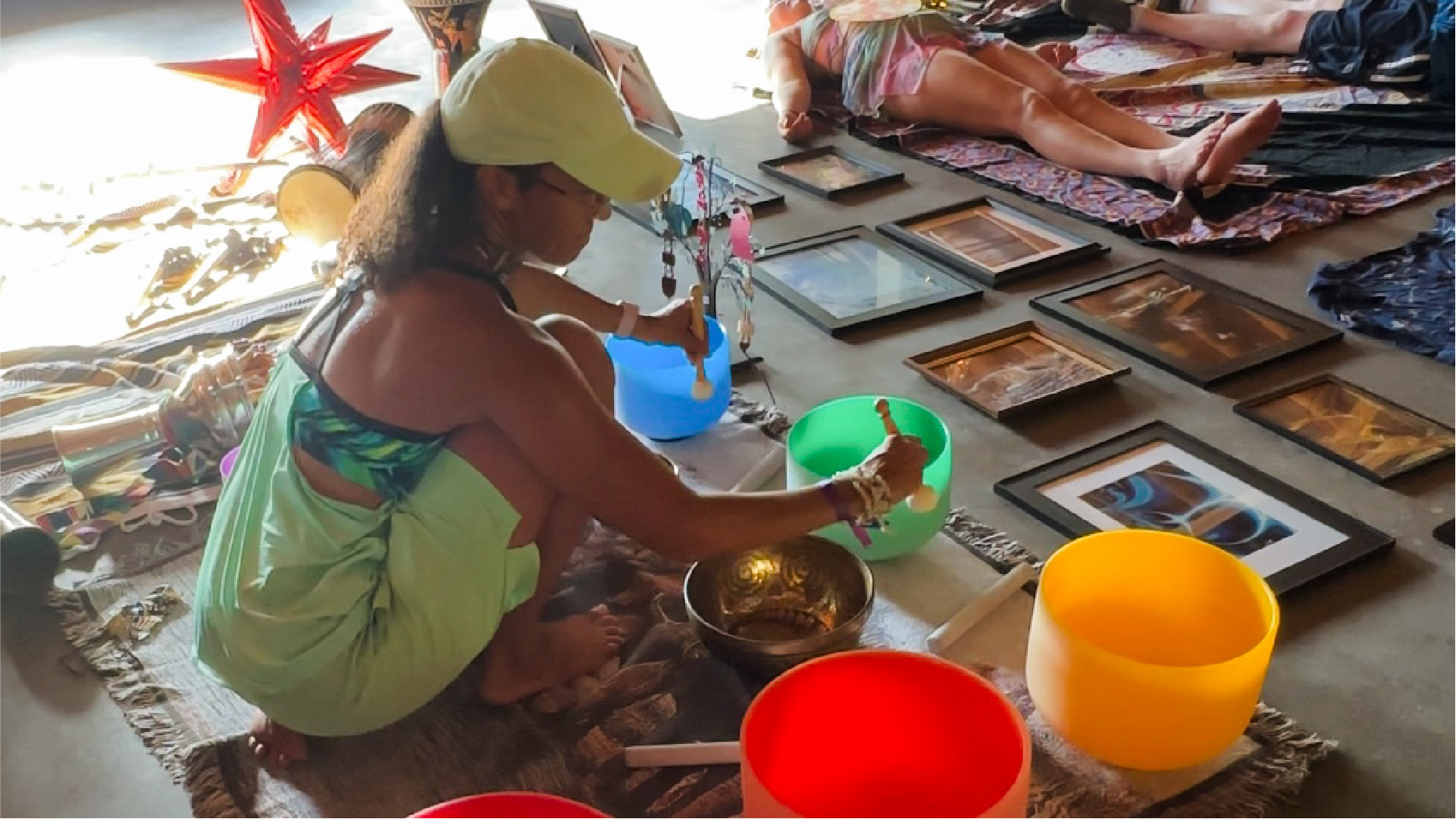 Image of Havalynn performing a sound bath for a group of women on retreat.