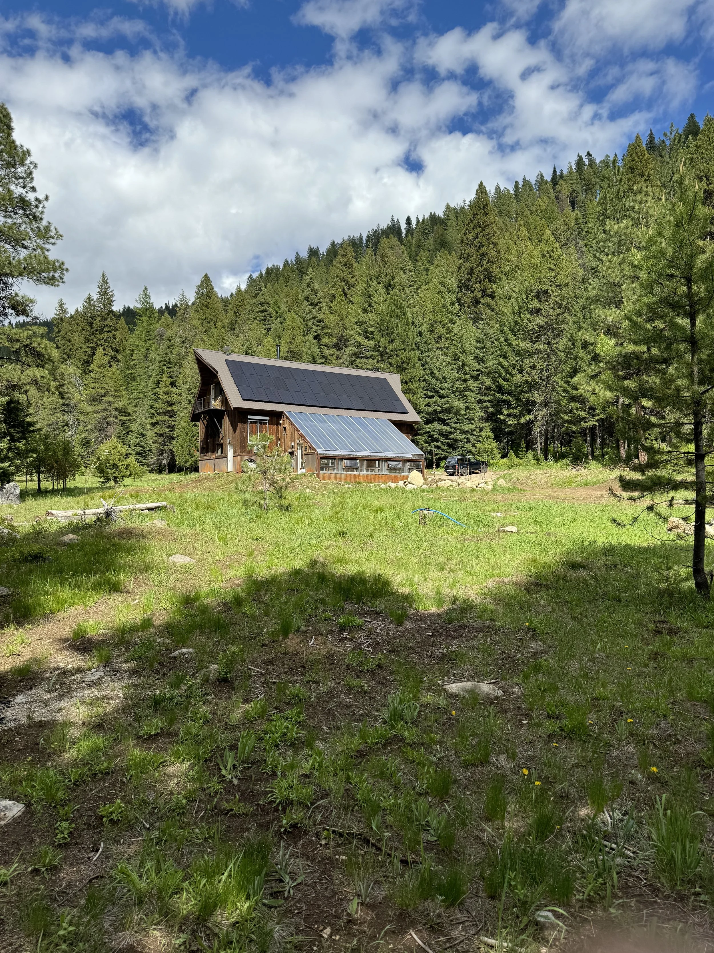 Solar panels on the Barn provide electricity for our off-grid retreat.