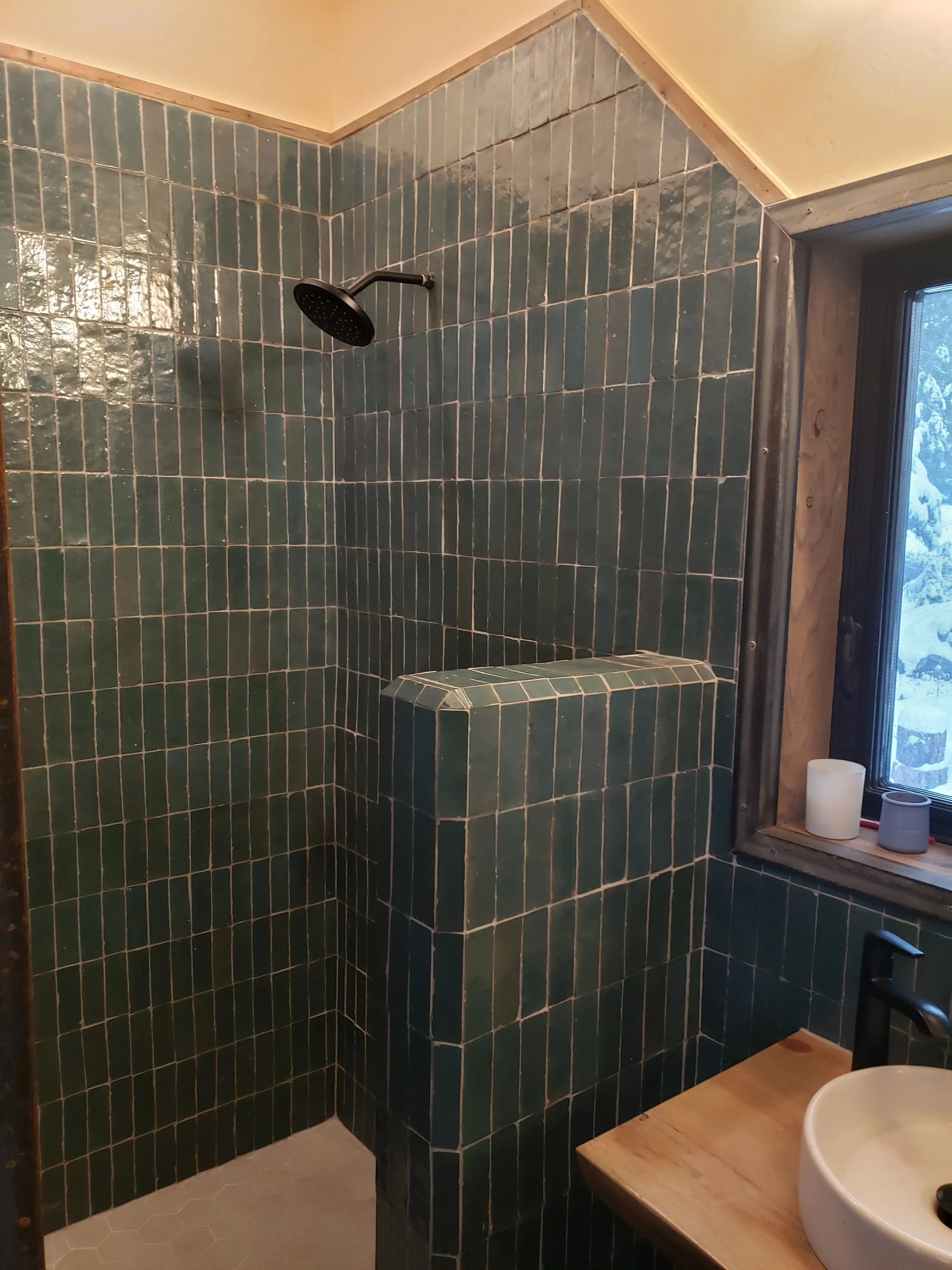 The shower in the Lodge made with hand made tile.