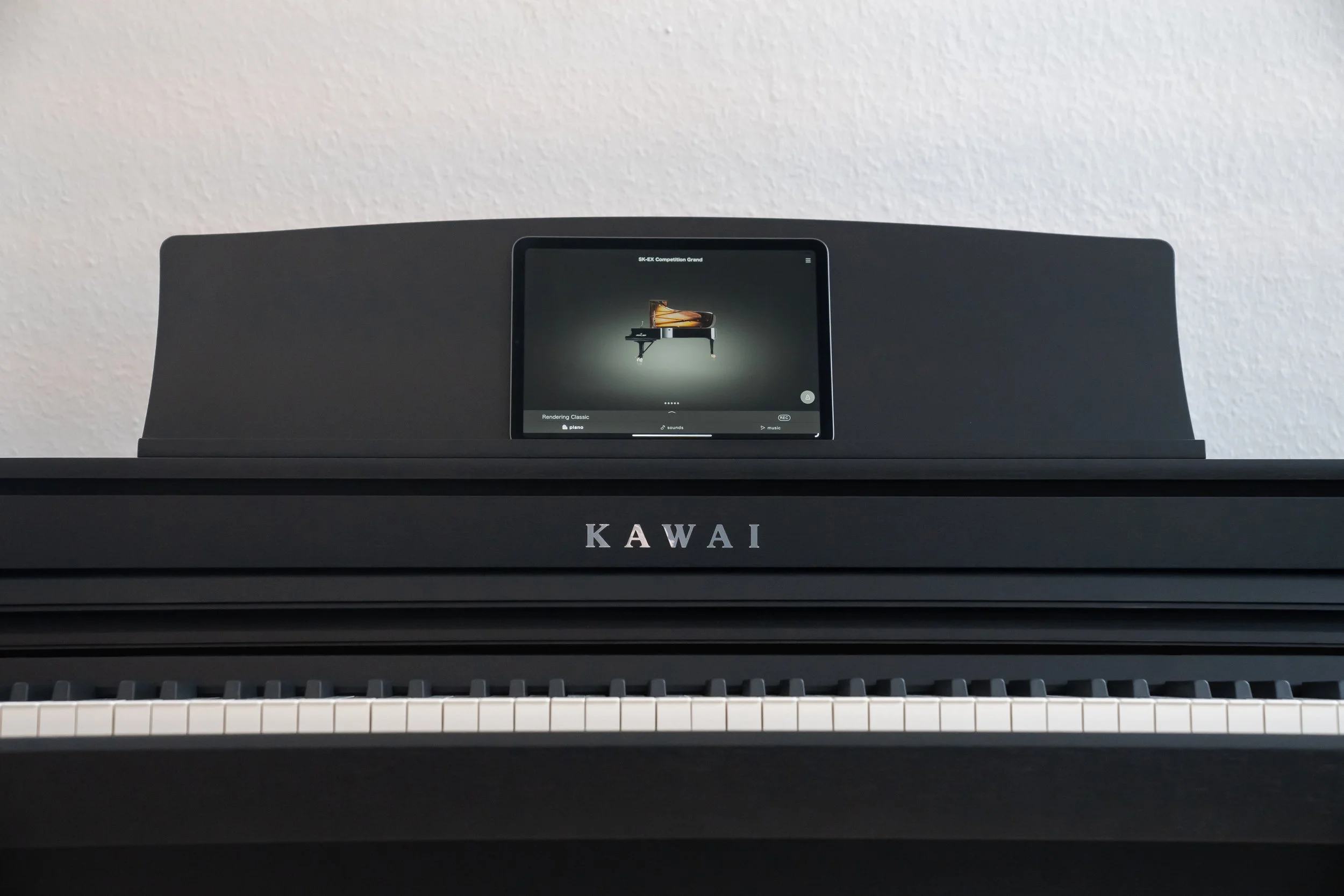 KAWAI CA401 with ipad on music desk and Kawai sound app displaying