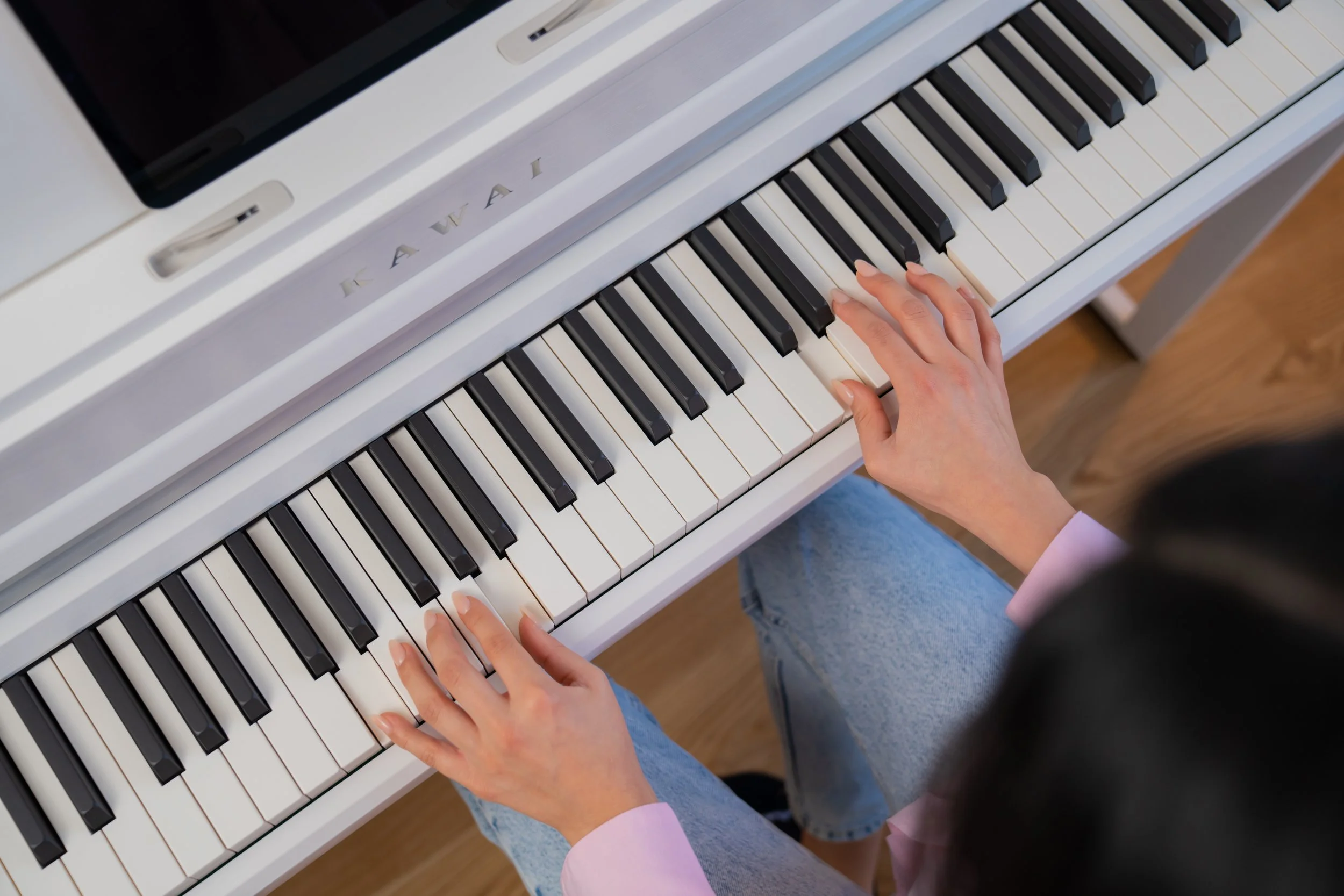 view of hands playing Kawai CA501 Digital Piano 