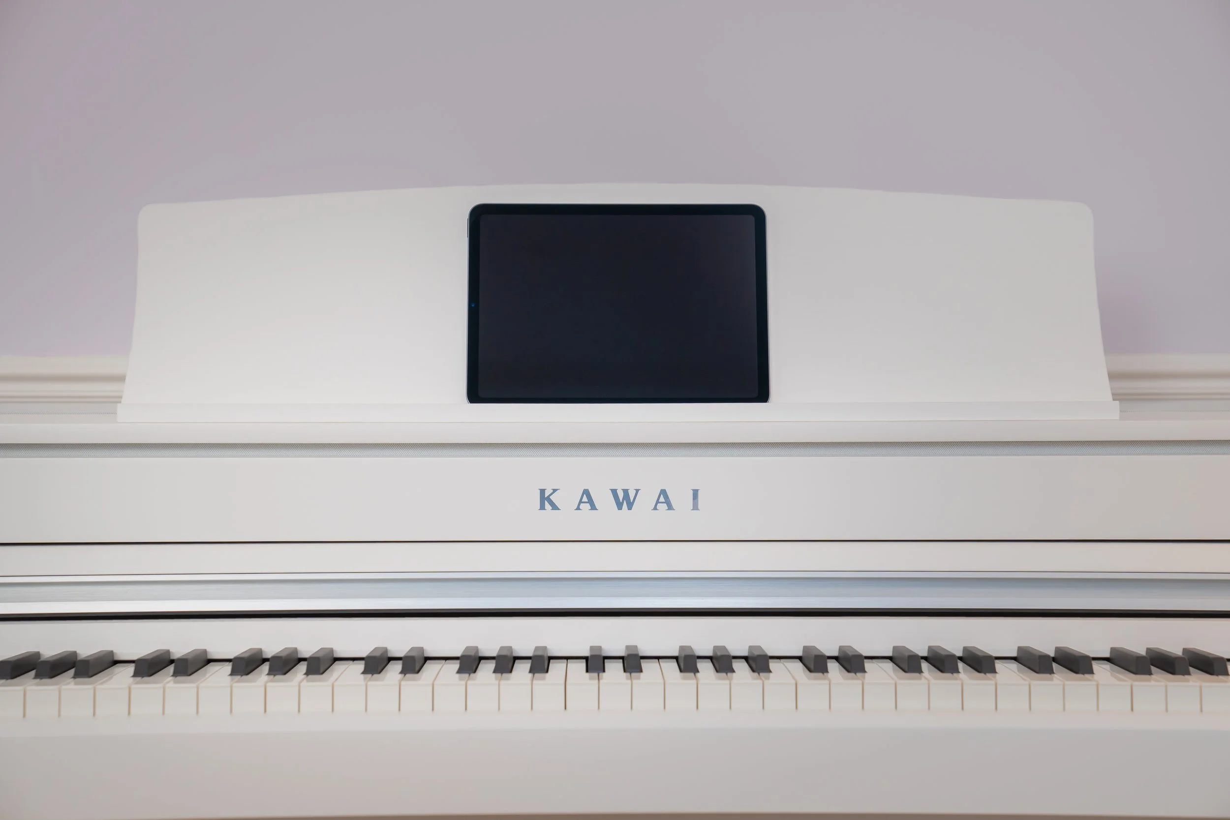 iPad sitting on Kawai CA501 Digital Piano 