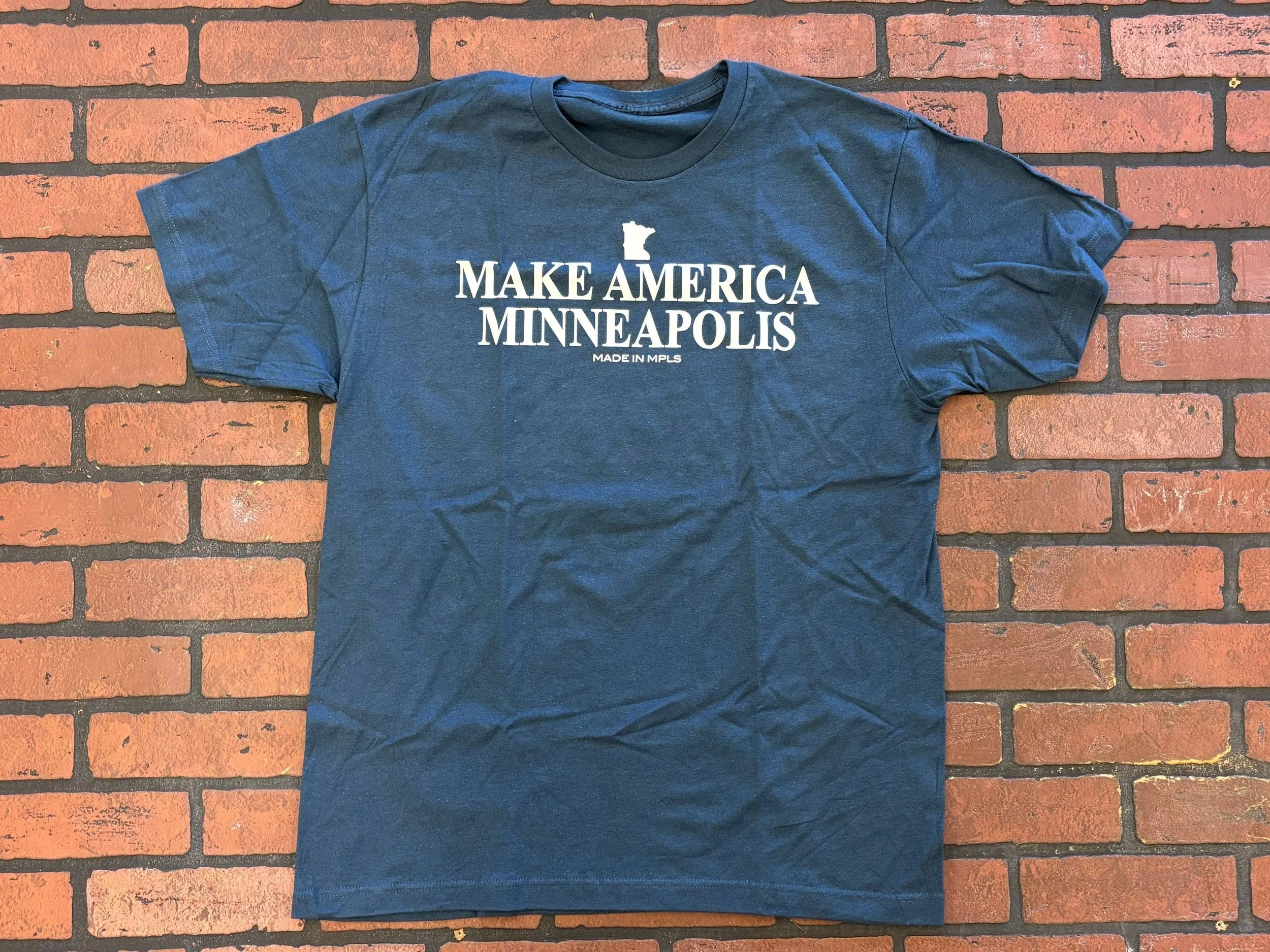 Unisex indigo T-shirt that says "Make America Minneapolis" in white print