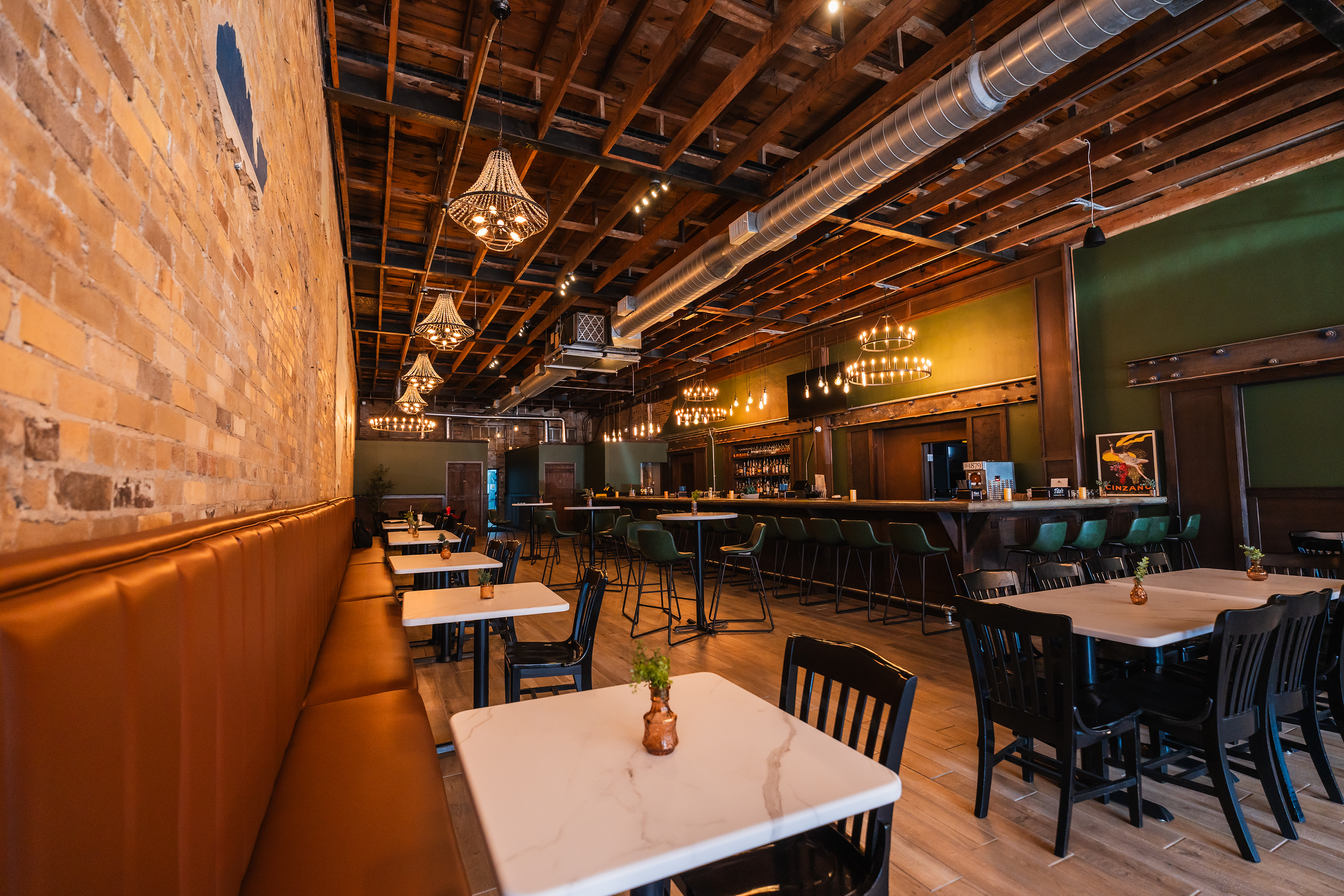The rustic interior and bar area of The 1879 Italian restaurant and pub in Sealy, Texas.