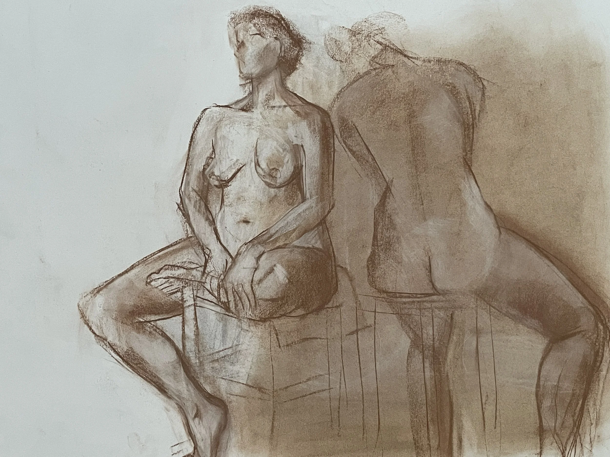 9.  Two seated nudes in brown conté.