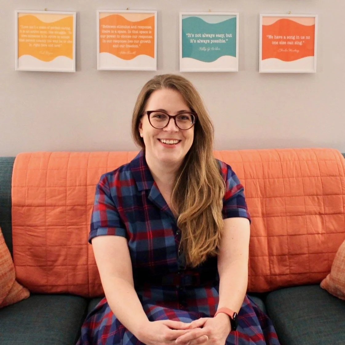 Photograph of the therapist on the couch in her office