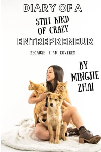 Book cover titled 'Diary of a Still Kind of Crazy Entrepreneur' by Muncie Zhai, featuring a woman sitting on the floor with three dogs and a cat.