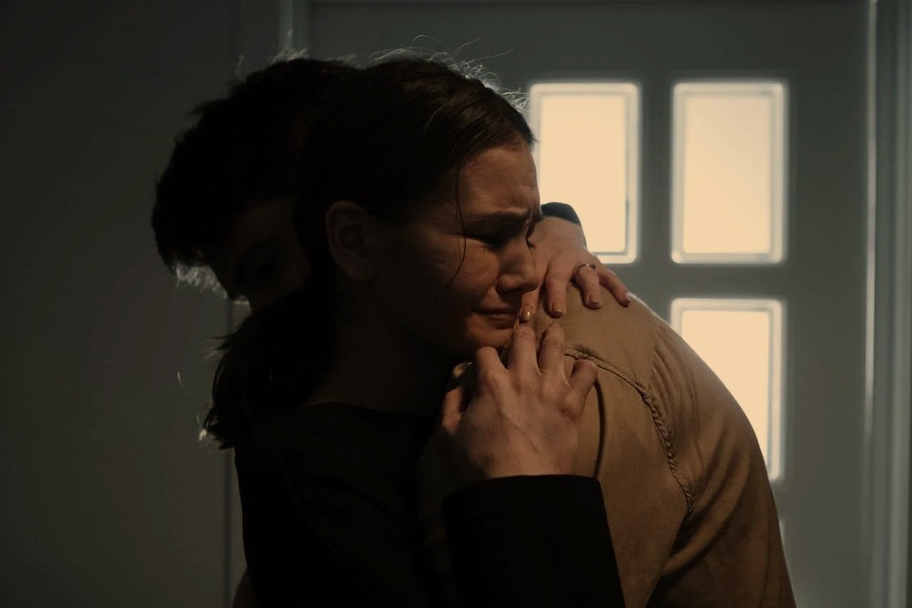 a sad couple embracing