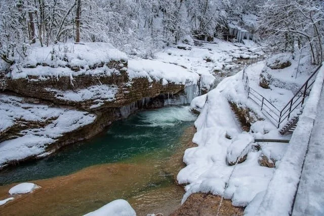 a river with snowy banks