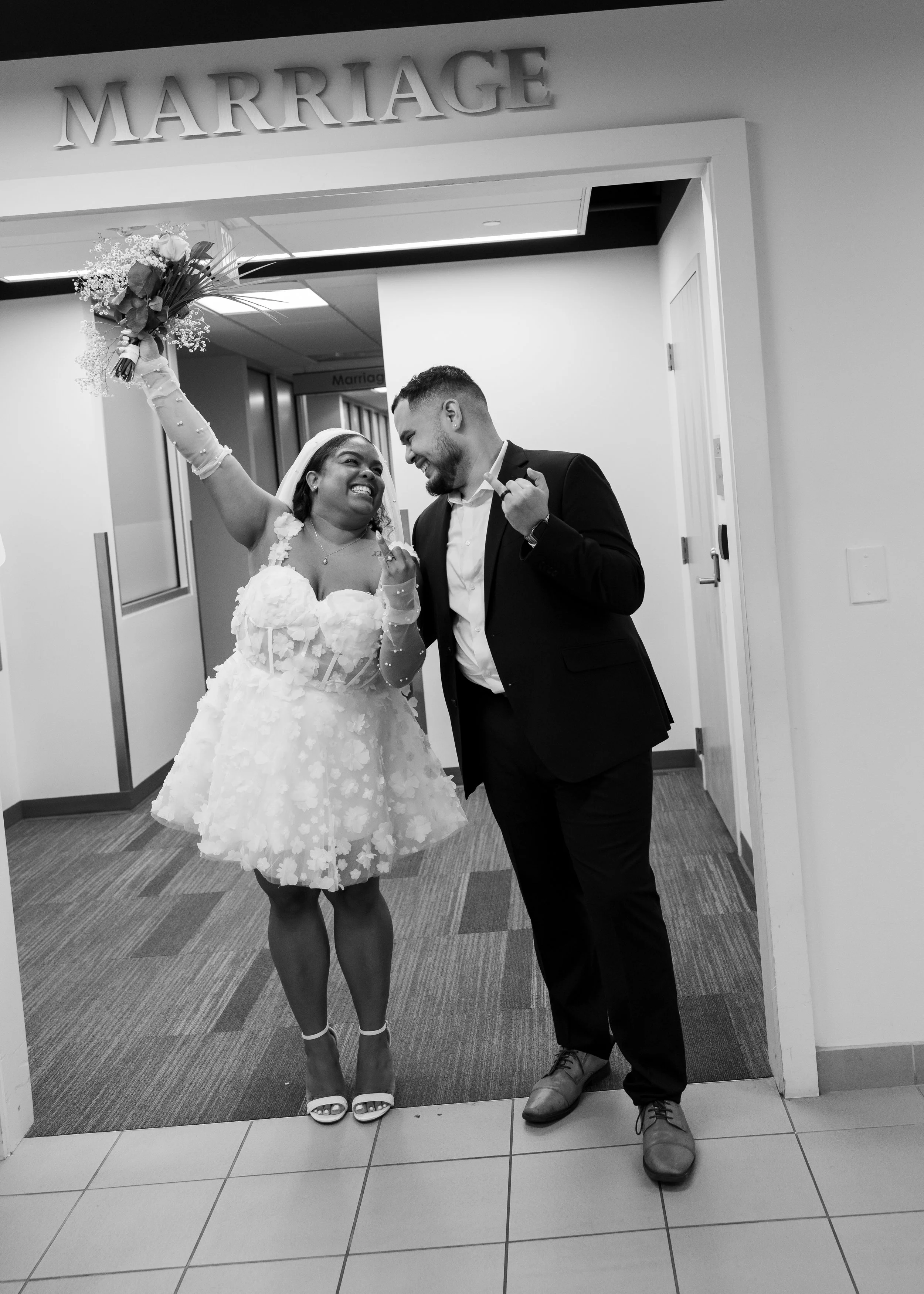 Couple at the courthouse celebrating their wedding