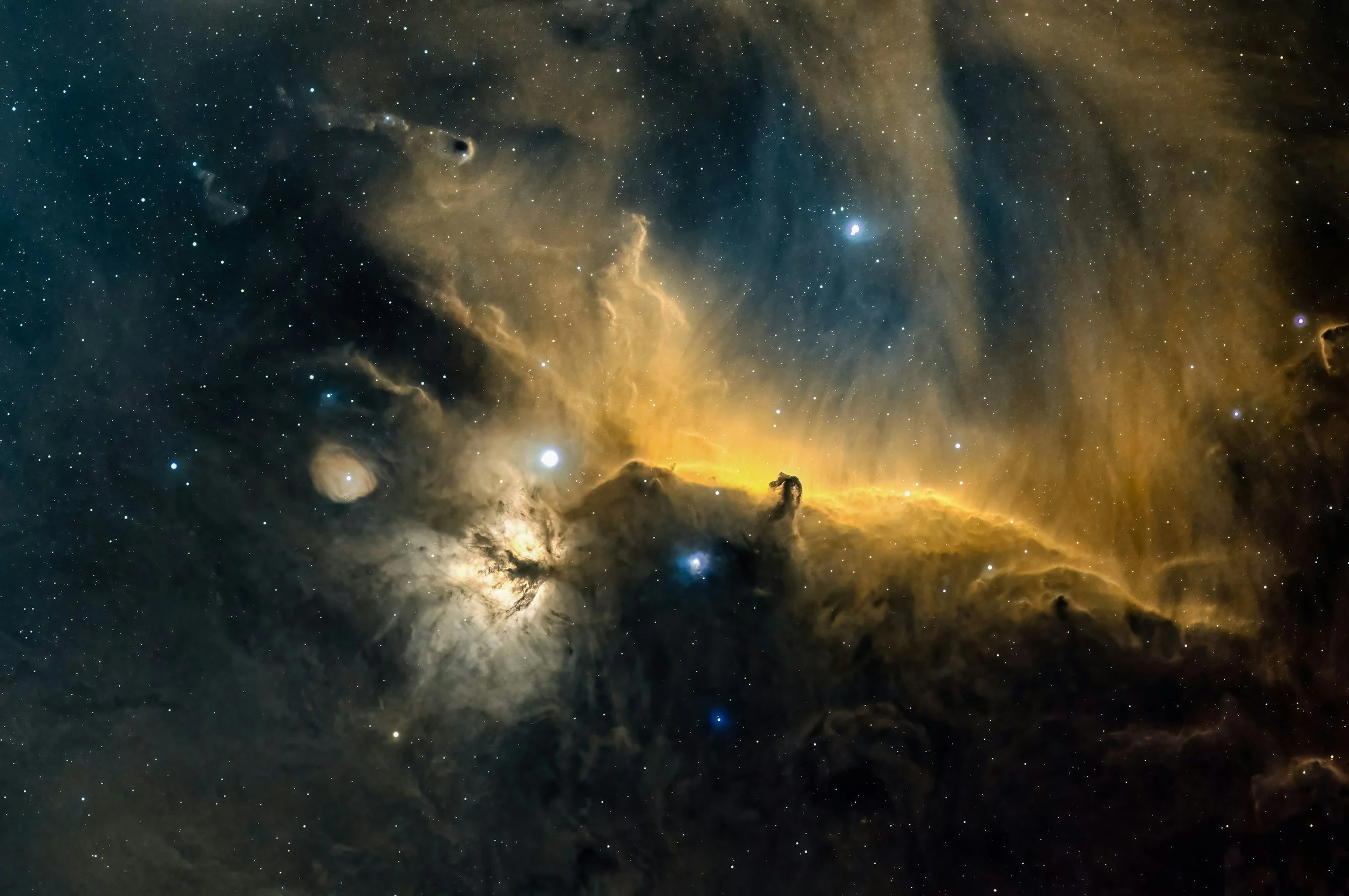 A detailed image of the Orion Nebula displaying bright stars, swirling clouds of gas and dust with a golden glow.