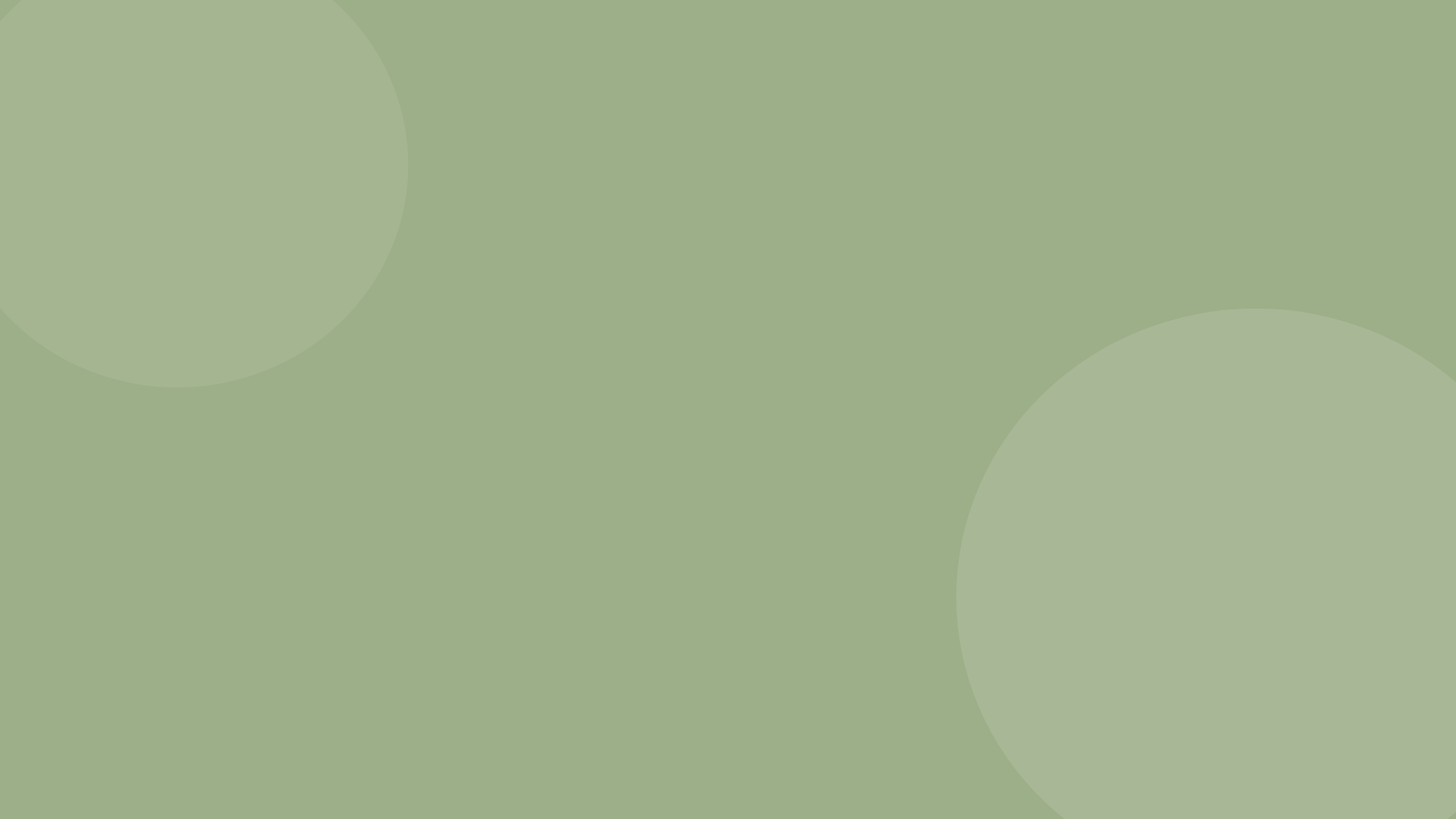 A blurred image with a predominantly light green background and large, faded circles or bubbles of darker green.