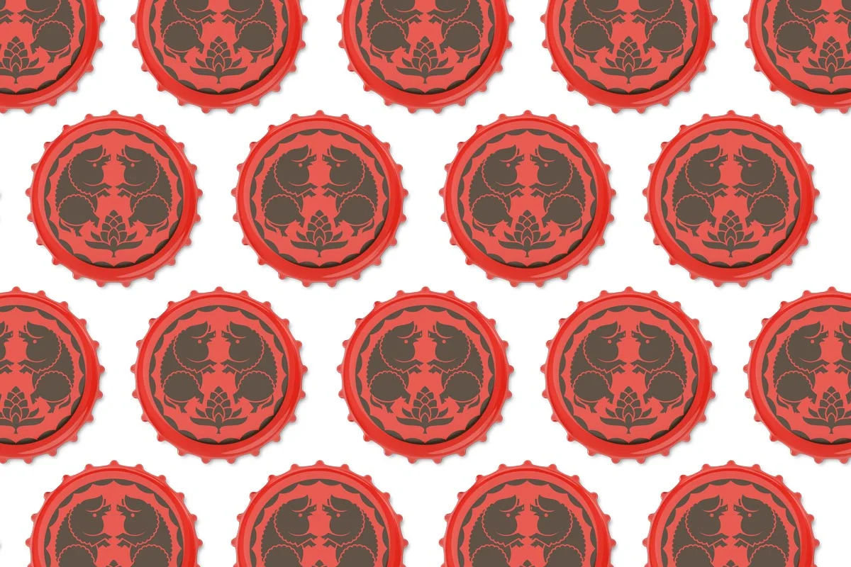 Pattern of red bottle caps with a black design featuring two dragons facing each other and floral elements.
