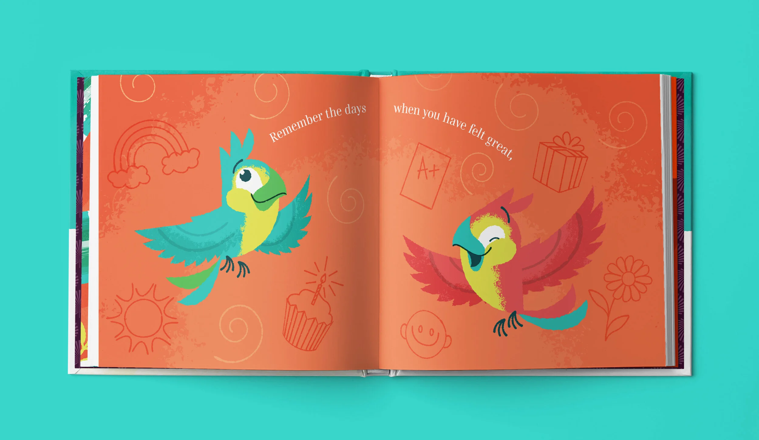 Open children's book with colorful illustrations of two laughing parrots on a coral background, surrounded by doodles of a rainbow, cupcake, sun, smiley face, gift box, and flower. Text reads: "Remember the days when you have felt great," and "..."