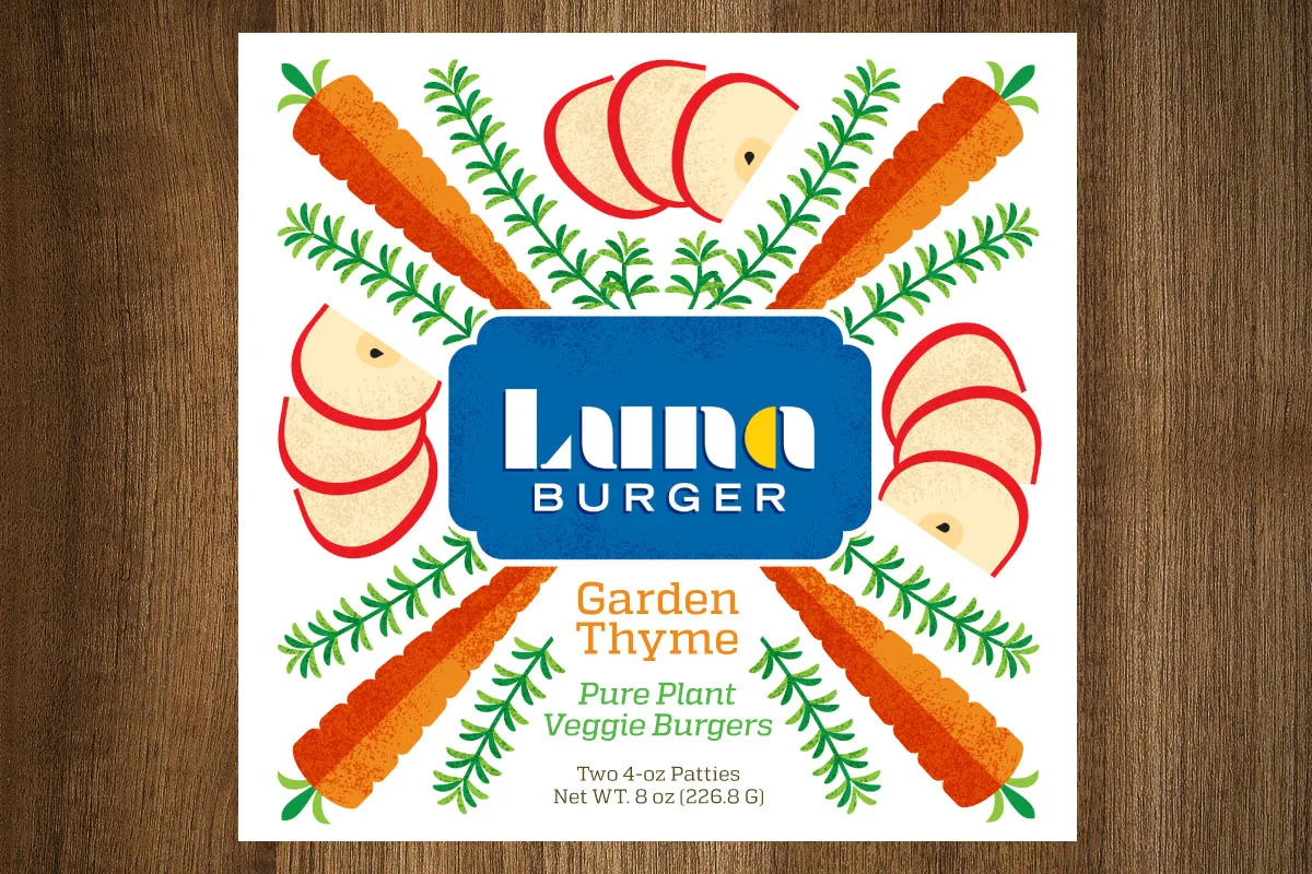 Packaging label for Landa Burger Garden Thyme veggie burgers featuring illustrations of carrots, sliced apples, and greenery, with text highlighting it as a plant-based product containing two 4-ounce patties.