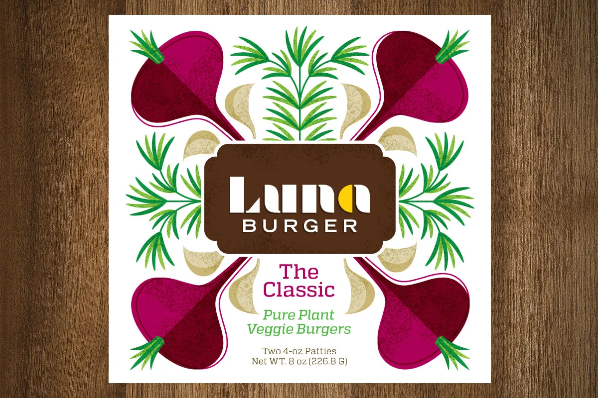 Packaging label for Laura's Burger featuring a symmetrical design with beets, ginger, and green herbs surrounding the brand name and product description for veggie burgers.