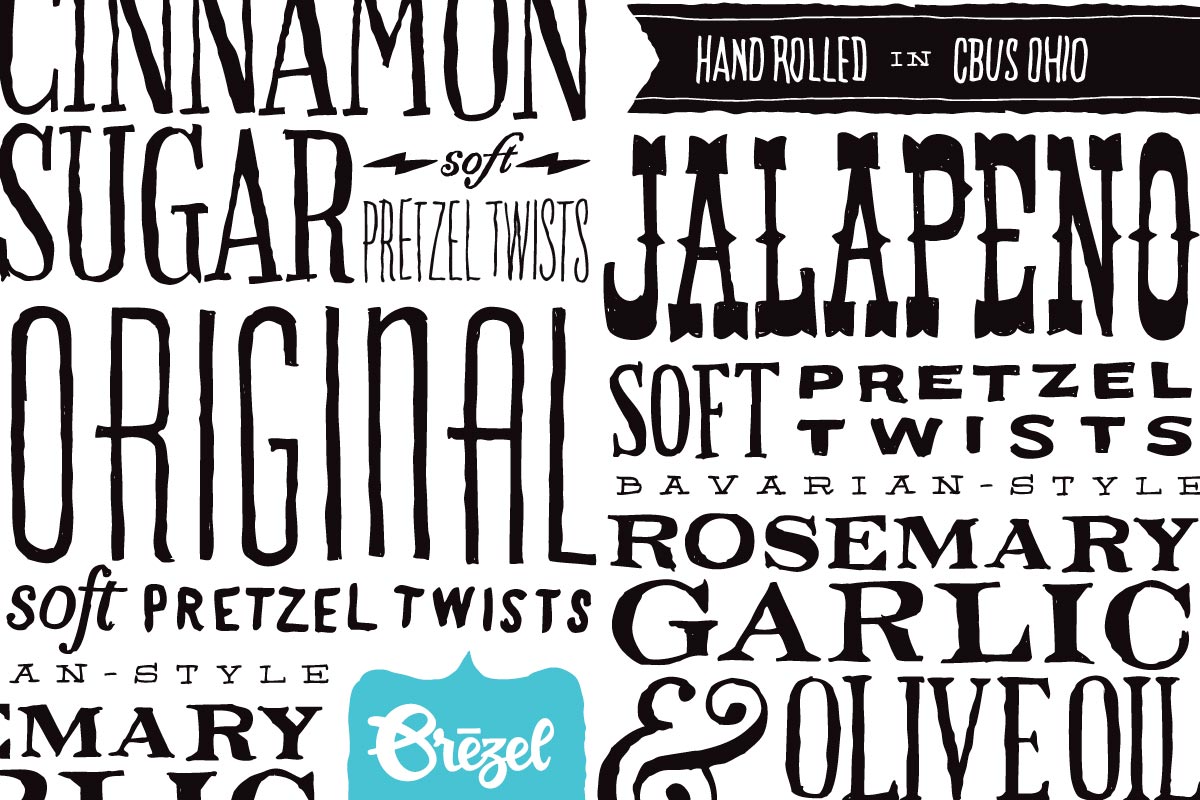 A black and white graphic with various words related to flavors and ingredients, including 'Cinnamon,' 'Sugar,' 'Pretzel Twists,' 'Jalapeño,' 'Original,' 'Rosemary,' 'Garlic,' and 'Olive Oil,' along with phrases like 'Hand Rolled in Ohio' and 'Soft P