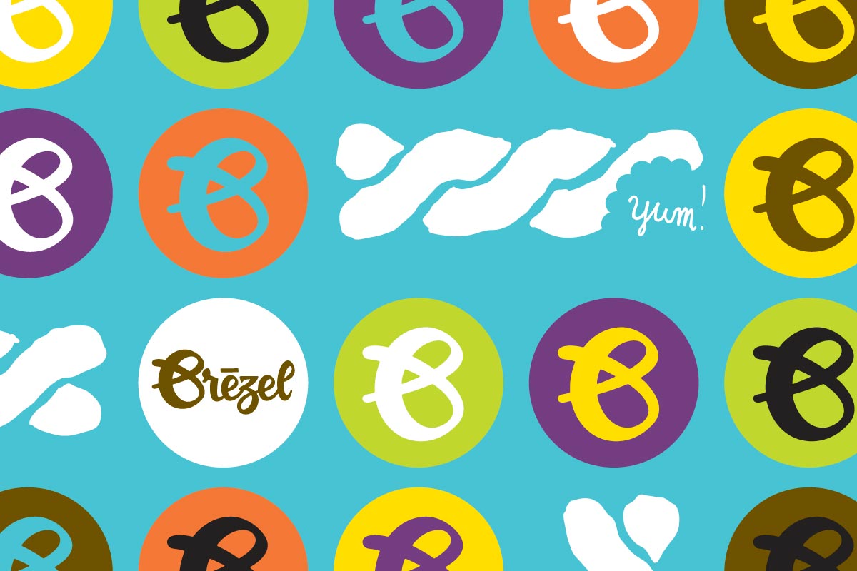 Colorful circles with a stylized lowercase letter 'b', some with names like 'Brëzel' and the word 'yum!' written in white on a blue background.