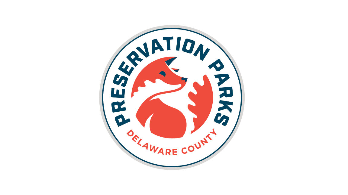 Logo of Preservation Parks of Delaware County with a stylized fox inside a circle, text around the circle reads "Preservation Parks" and "Delaware County."