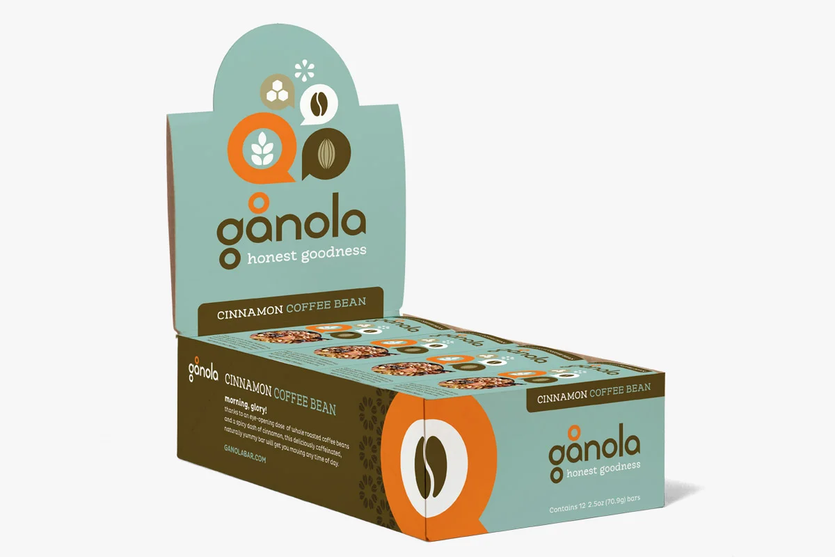 Box of Gañola cinnamon coffee bean snack bars, with teal and brown packaging, 12 bars total.