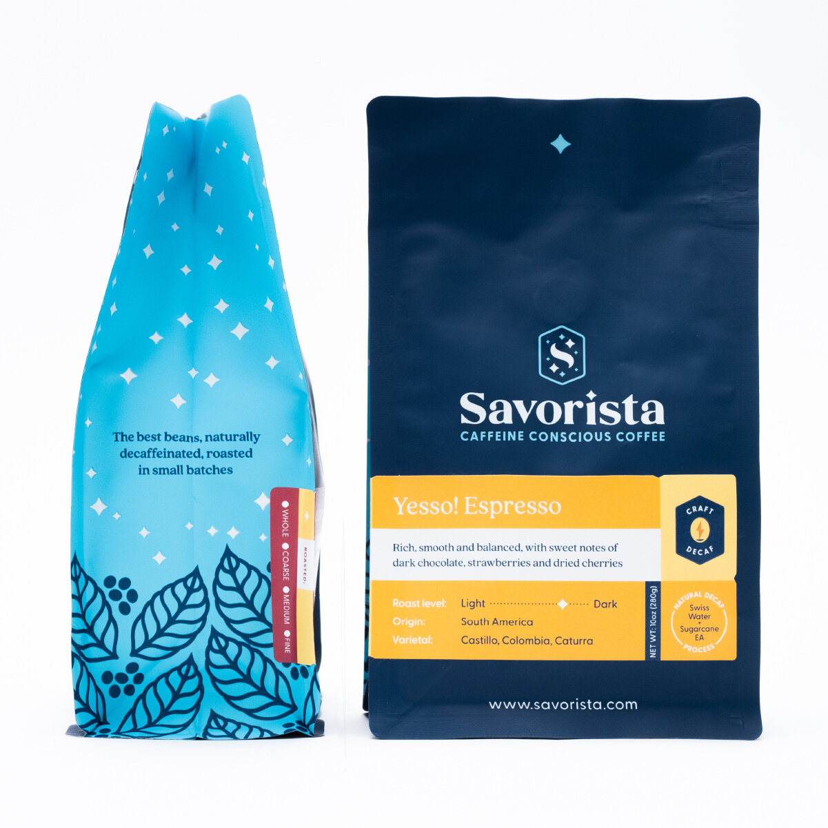 Two bags of coffee from Savorista, one in a blue packaging with a leaf design and the other in a dark blue and yellow packaging labeled Yesso! Espresso.