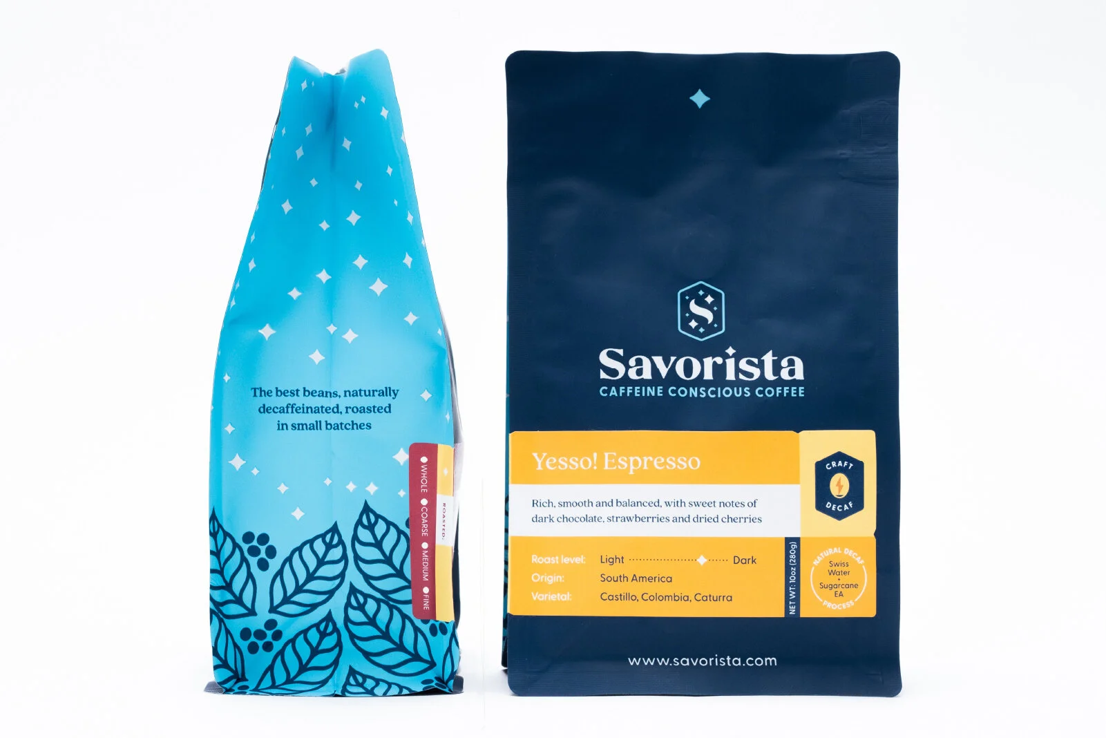 Two bags of Savorista coffee, one on the left with a blue design and the right with a dark blue background. The right bag is labeled 'Yeso! Espresso,' and the left bag has a blue leafy pattern with a description about beans.