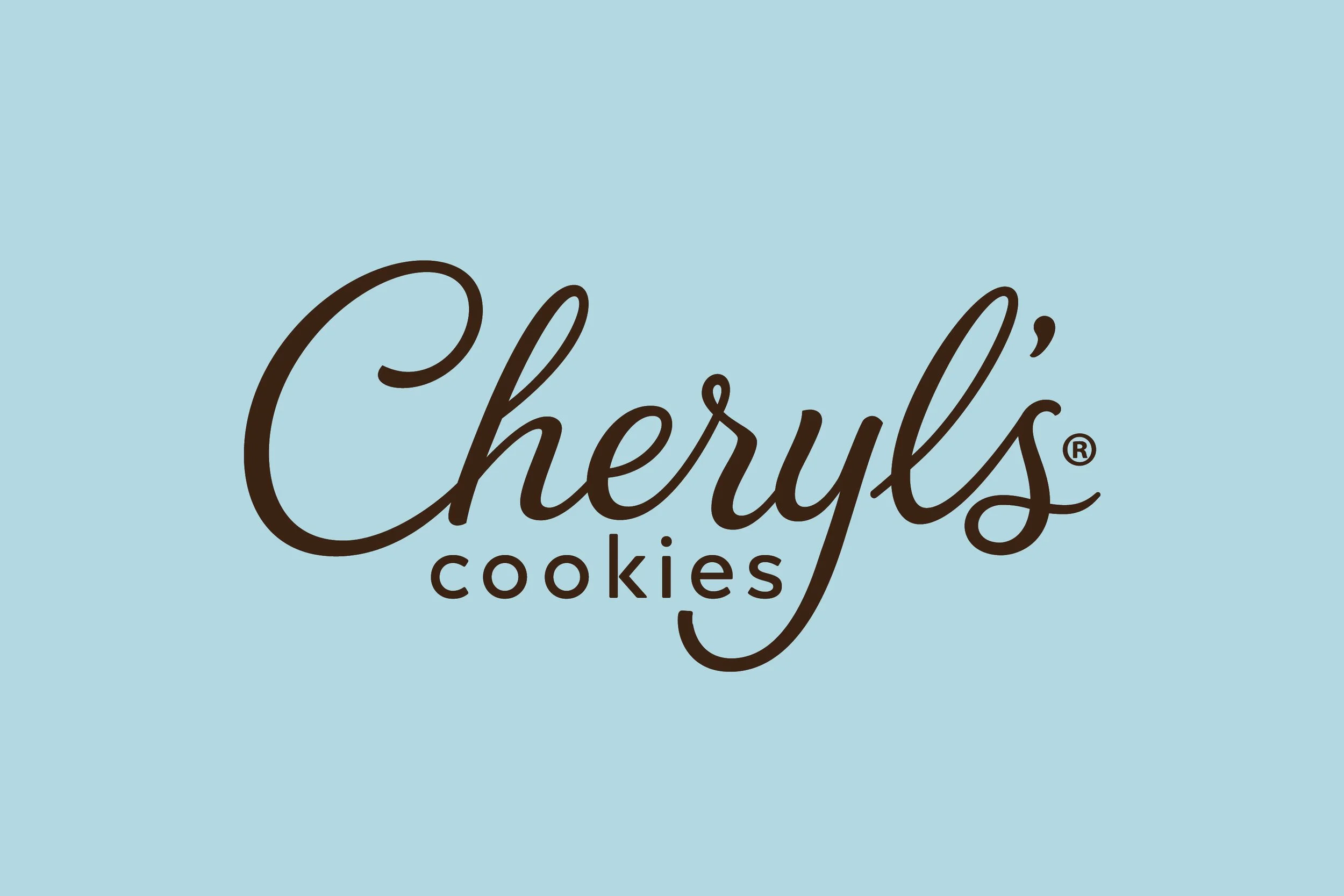 A logo with the words "Cheryl's Cookies" written in a cursive font on a light blue background.